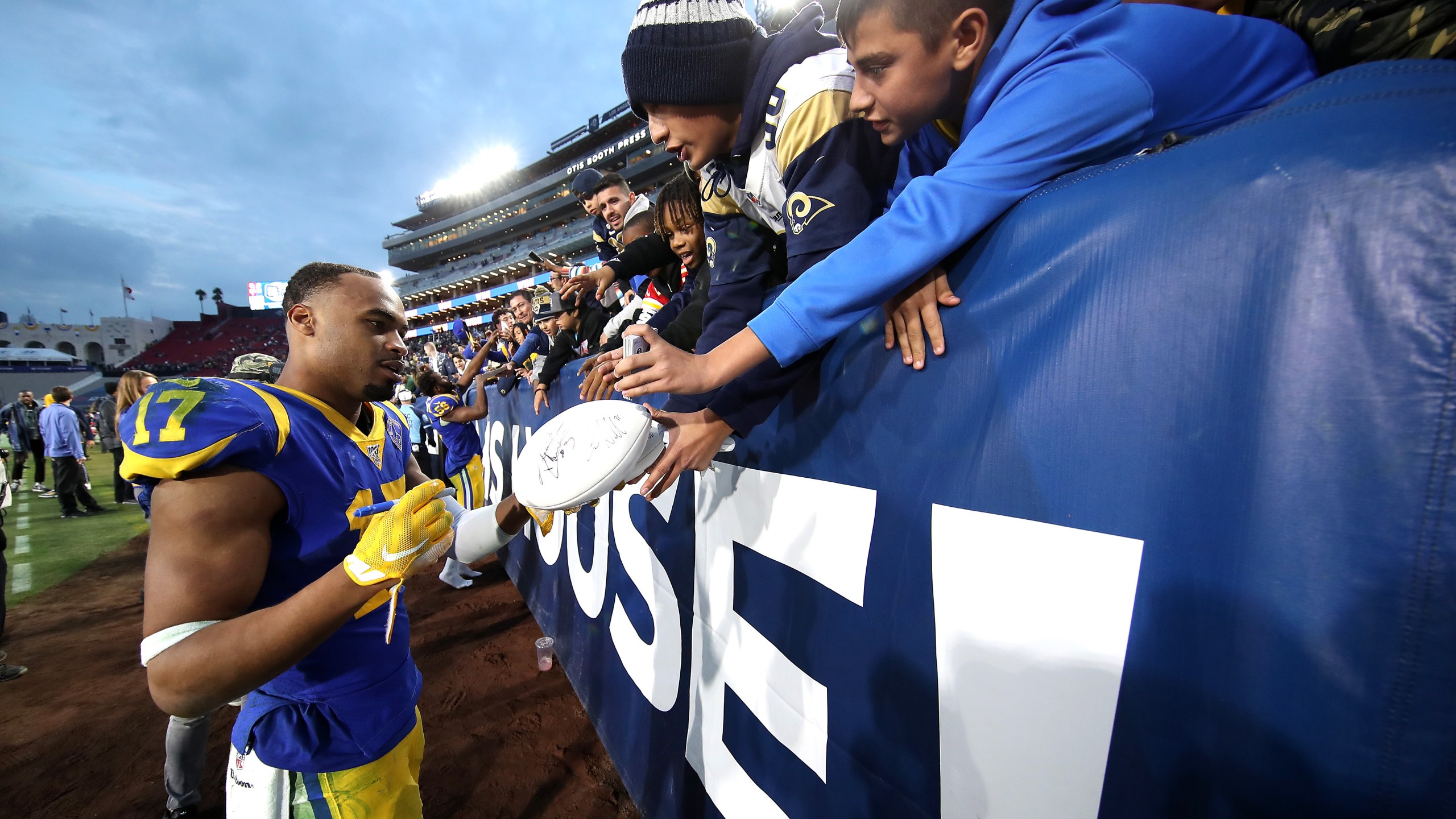 Robert Woods of the Los Angeles Rams signs autographs for fans after a game against the Arizona Cardinals at Los Angeles Memorial Coliseum on Dec. 29, 2019. (Credit: Sean M. Haffey/Getty Images)