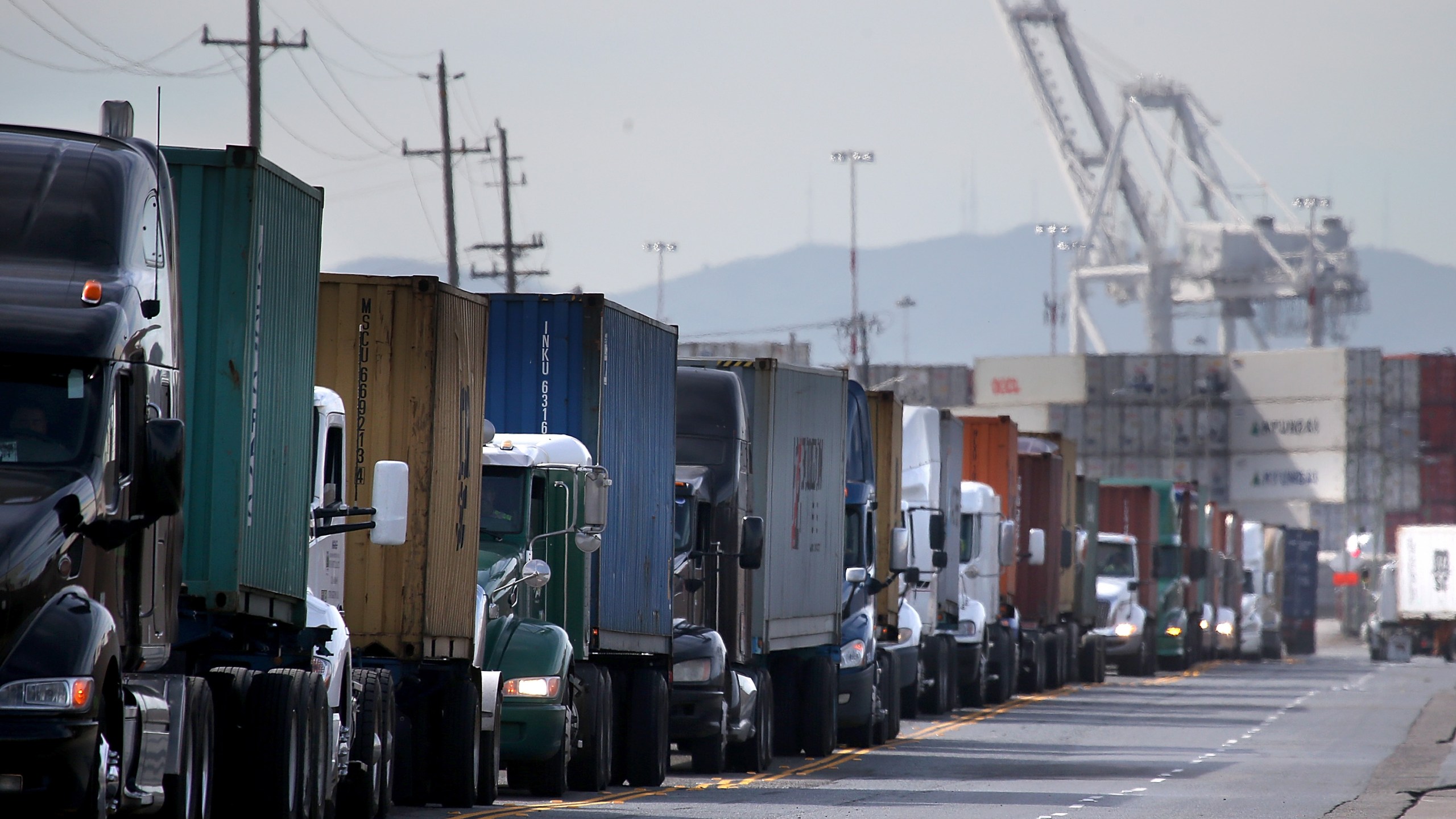 Trucks line up to enter a berth at the Port of Oakland on Feb. 11, 2015. (Credit: Justin Sullivan / Getty Images)