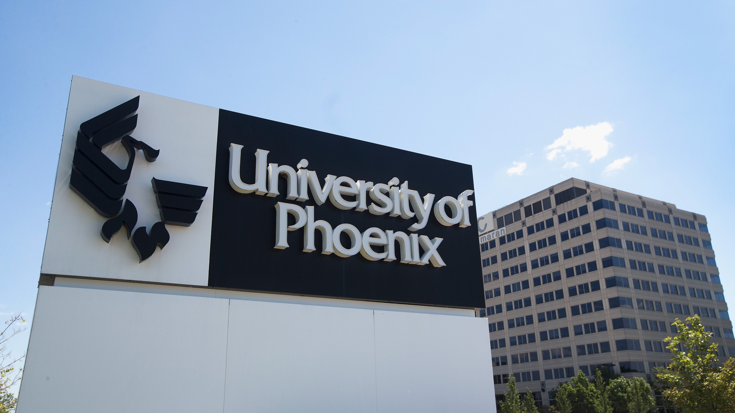 A sign marks the location of the University of Phoenix Chicago Campus on July 30, 2015 in Schaumburg, Illinois. (Credit: Scott Olson/Getty Images)