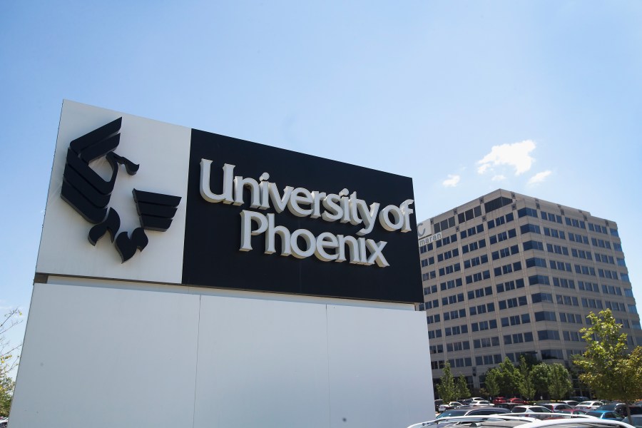 A sign marks the location of the University of Phoenix Chicago Campus on July 30, 2015 in Schaumburg, Illinois. (Credit: Scott Olson/Getty Images)