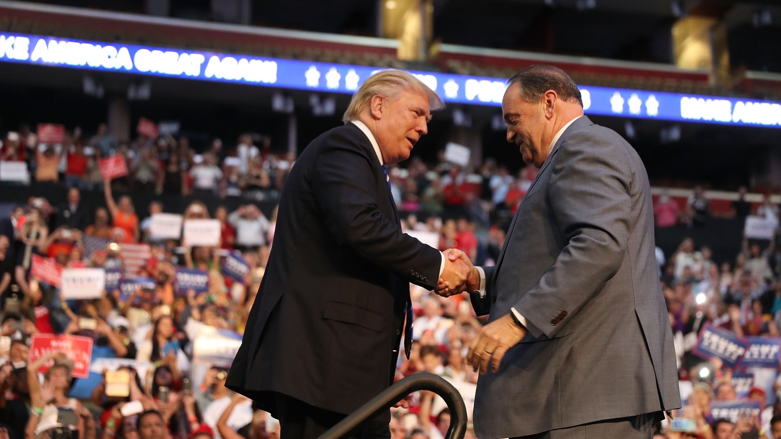 Donald Trump is greeted by former Arkansas Gov. Mike Huckabee during a campaign event at the BB&T Center on Aug. 10, 2016 in Fort Lauderdale, Florida. (Credit: Joe Raedle/Getty Images)