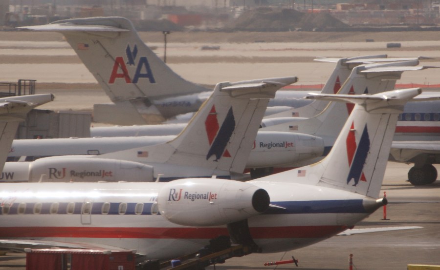 An American Airlines jet taxis past American Eagle jets in a March 2008 file photo. (Credit: Scott Olson/Getty Images)