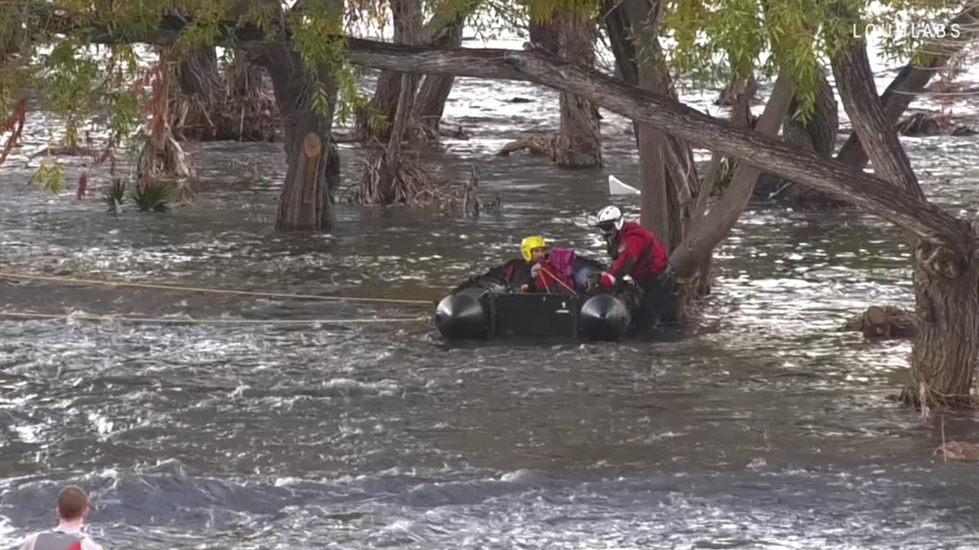 Los Angeles Fire Department firefighters rescue a man from the Los Angeles river in Atwater Village following a storm on Dec. 8, 2019. (Credit: LOUDLABS)