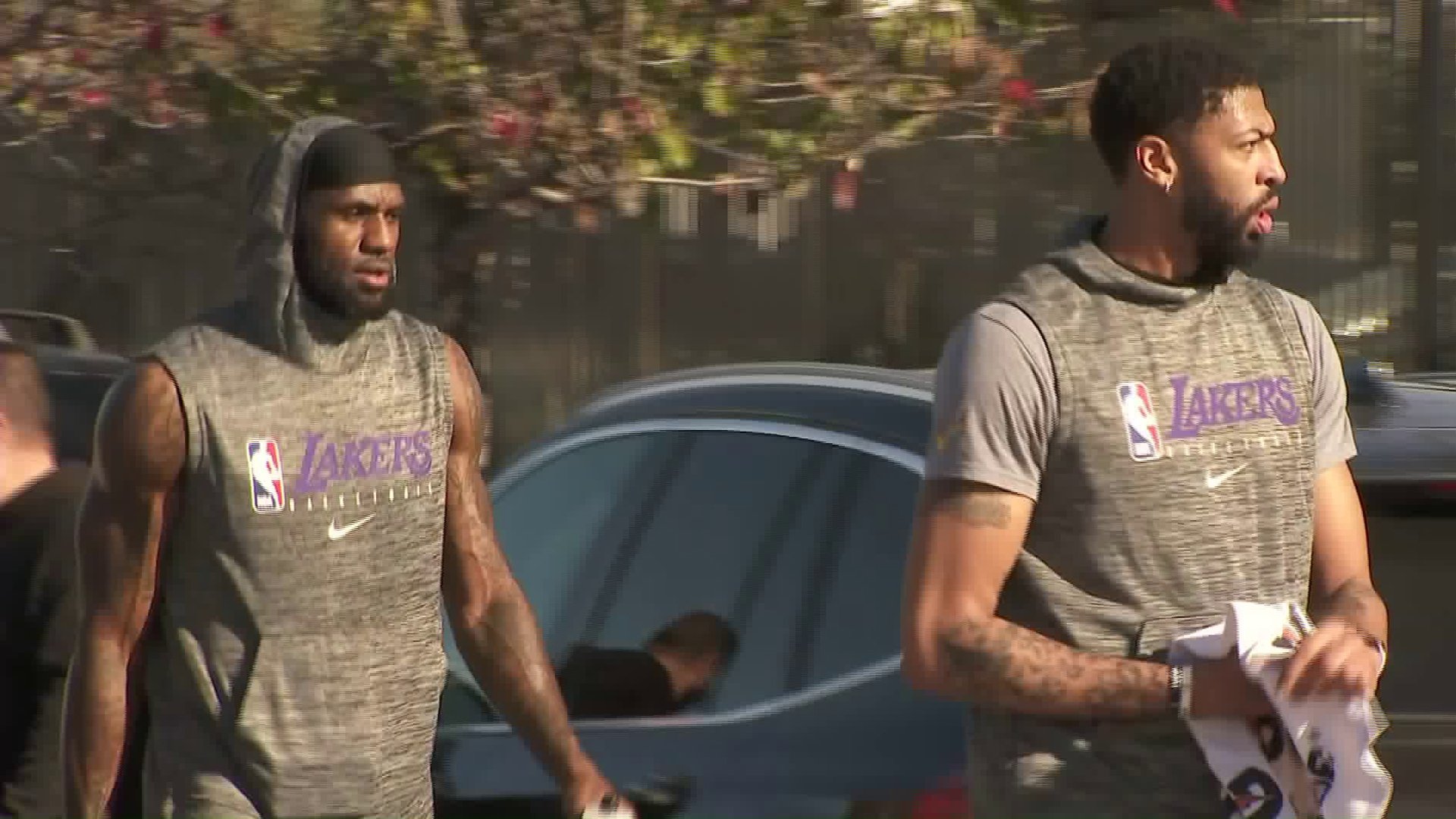 LeBron James, left, and Anthony Davis walk to the Los Angeles Lakers’ practice facility in El Segundo on Jan. 29, 2020. (Credit: KTLA)