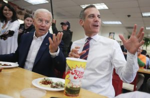 Former Vice President and Democratic presidential candidate Joe Biden eats at a King Taco restaurant with Los Angeles Mayor Eric Garcetti on May 8, 2019. (Credit: Mario Tama/Getty Images)