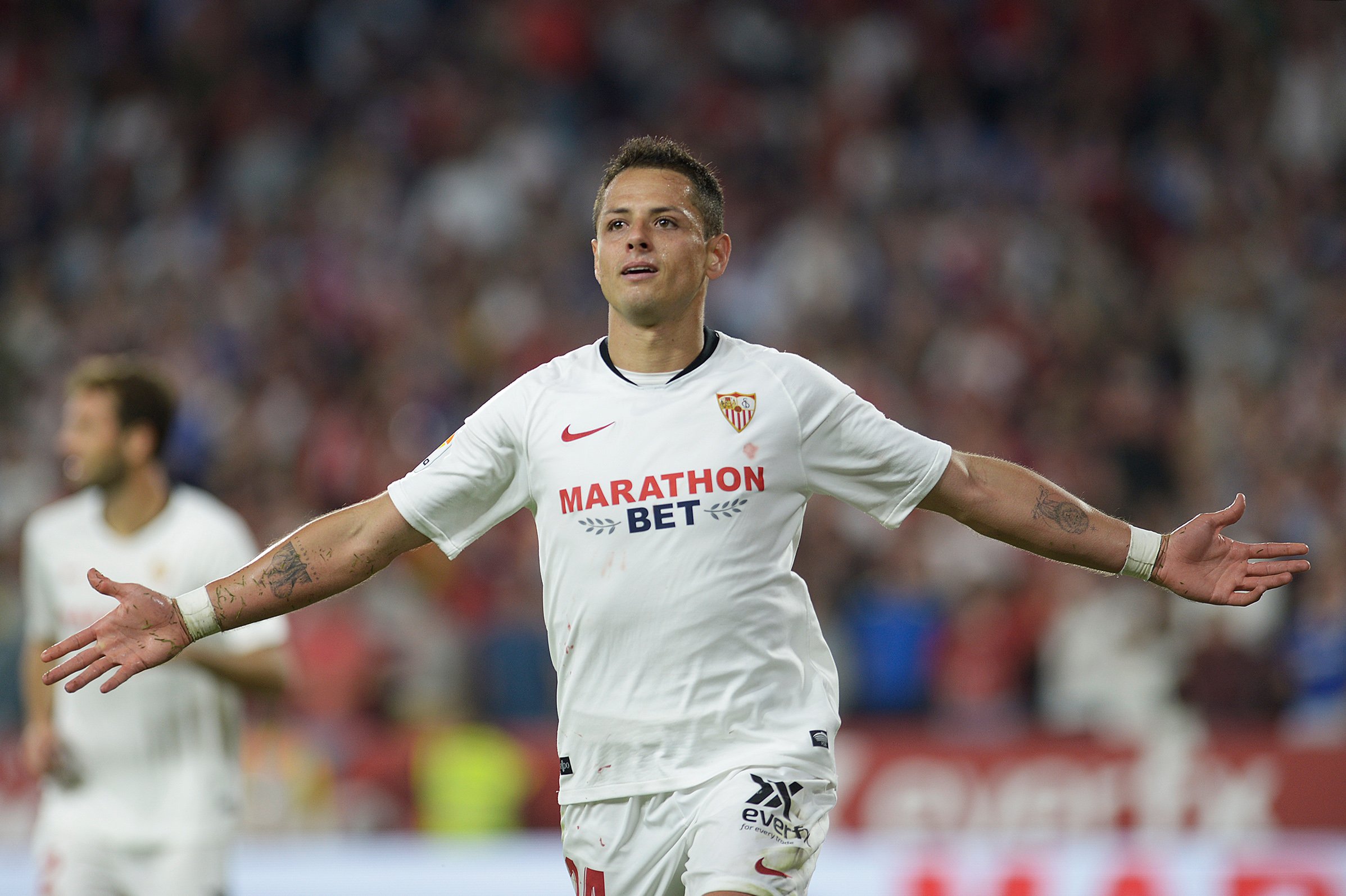 Sevilla's Mexican forward Javier "Chicharito" Hernandez celebrates after scoring a goal during the Spanish league football match between Sevilla FC and Getafe CF in Seville on Oct. 27, 2019. (Credit: Cristina Quicler / AFP / Getty Images)