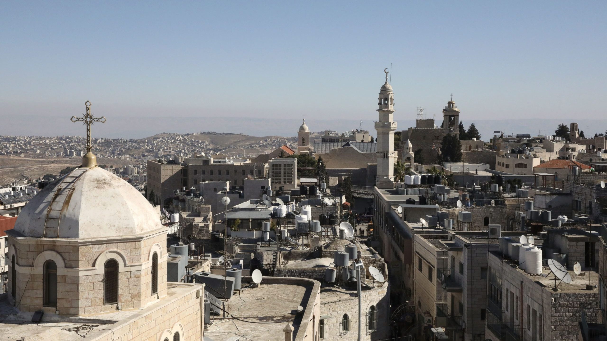 A general view of the West Bank biblical city of Bethlehem on Dec. 19, 2019, shows the minaret of a mosque and the Church of the Nativity, top right, the site where Christians believe Jesus was born. (Credit: HAZEM BADER/AFP via Getty Images)