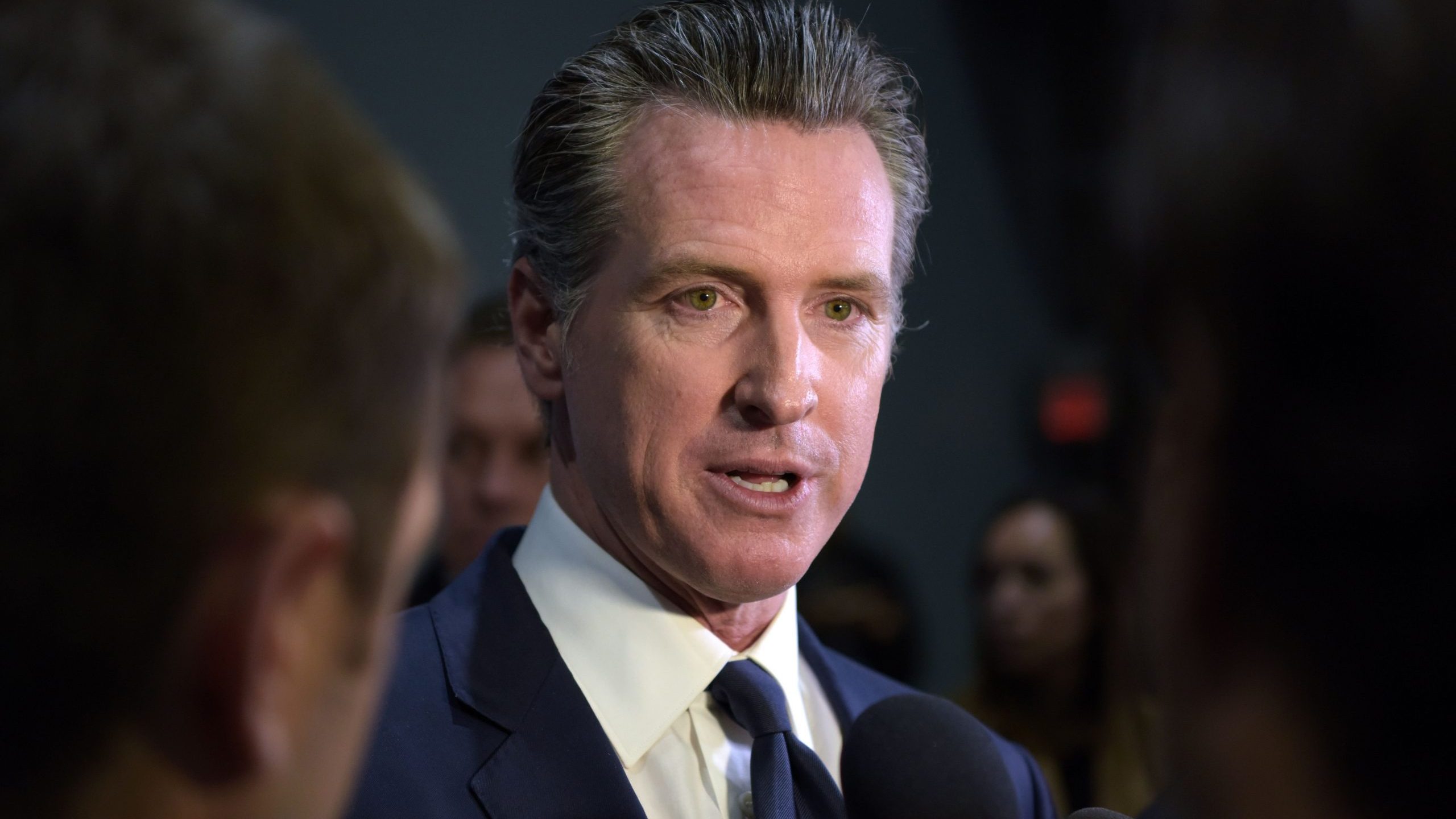 Gov. Gavin Newsom speaks to the press after the sixth Democratic primary debate of the 2020 presidential campaign at Loyola Marymount University in Los Angeles on Dec. 19, 2019. (Credit: AGUSTIN PAULLIER/AFP via Getty Images)