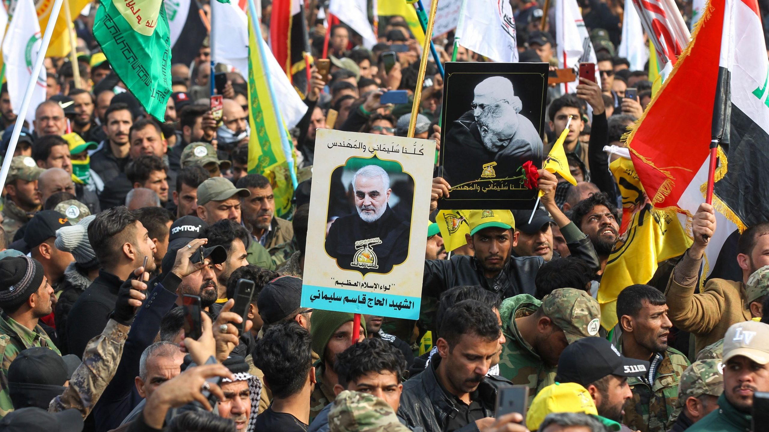 Supporters of the Hashed al-Shaabi paramilitary force and Iraq's Hezbollah brigades attend the funeral of Iranian military commander Qassem Soleimani in Baghdad's district of al-Jadriya on Jan. 4, 2020. (Credit: AHMAD AL-RUBAYE/AFP via Getty Images)