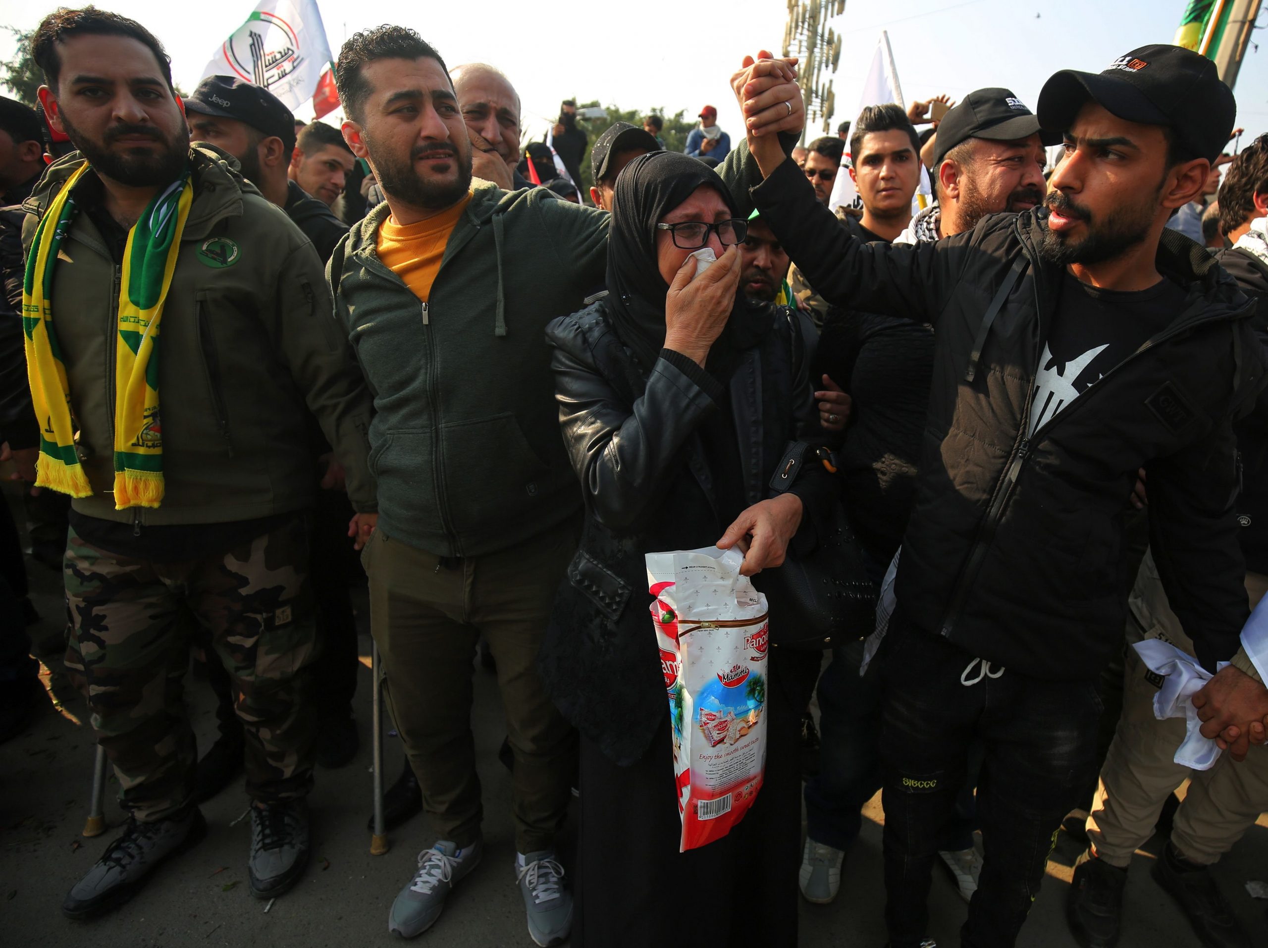 Mourners take part in the funeral procession of Iraqi paramilitary chief Abu Mahdi al-Muhandis, Iranian military commander Qasem Soleimani and eight others in the capital Baghdad's district of al-Jadriya, near the high-security Green Zone, on Jan. 4, 2020. (Credit: AHMAD AL-RUBAYE/AFP via Getty Images)