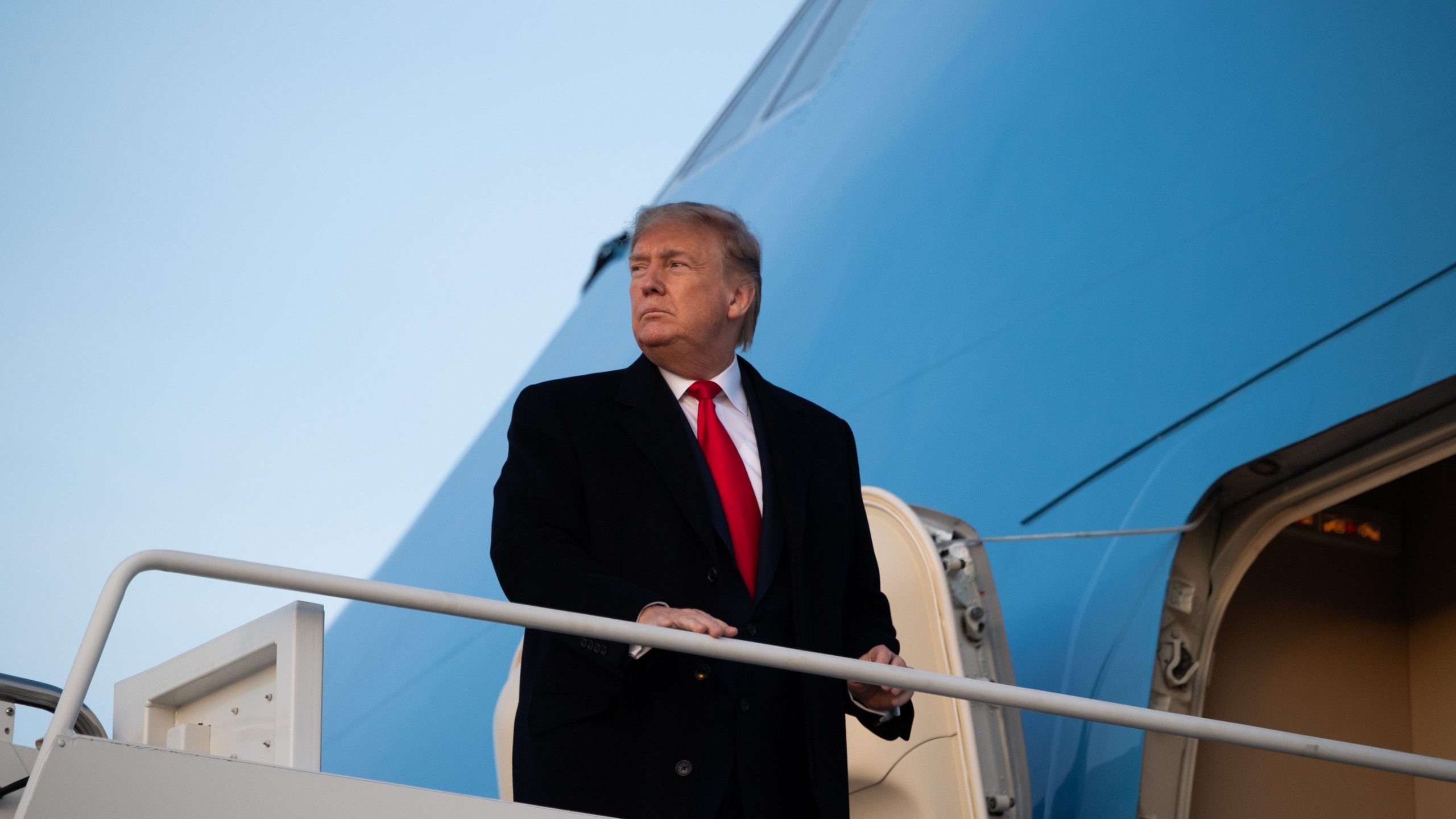 President Donald Trump boards Air Force One prior to departure from Joint Base Andrews in Maryland on Jan. 9, 2020, headed to a campaign rally in Toledo, Ohio. (Credit: Saul Loeb / AFP / Getty Images)