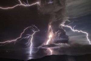 Lightning strikes as a column of ash surrounds the crater of Taal Volcano as it erupts on Jan. 12, 2020, as seen from Tagaytay city, Cavite province, Philippines. (Credit: Ezra Acayan/Getty Images)