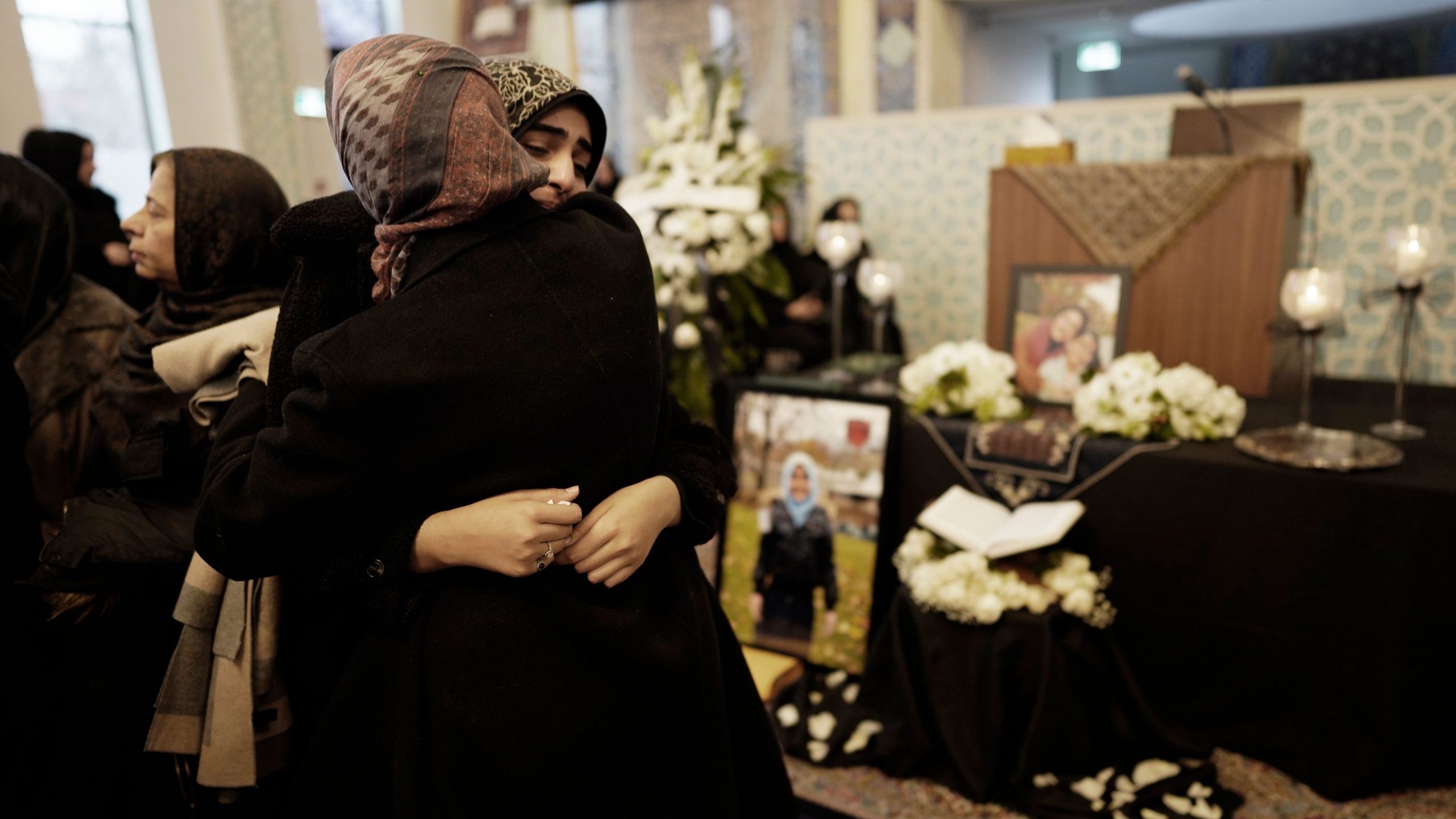 Mourners gather at the Imam Mahdi Islamic Centre in Toronto, Ontario on Jan. 12, 2020 to mourn Sahar Haghjoo and her 9-year-old daughter Elsa Jadidi, who were among the passengers of Ukrainian Airlines flight 752, which was shot down over Iran. (Credit: GEOFF ROBINS/AFP via Getty Images)