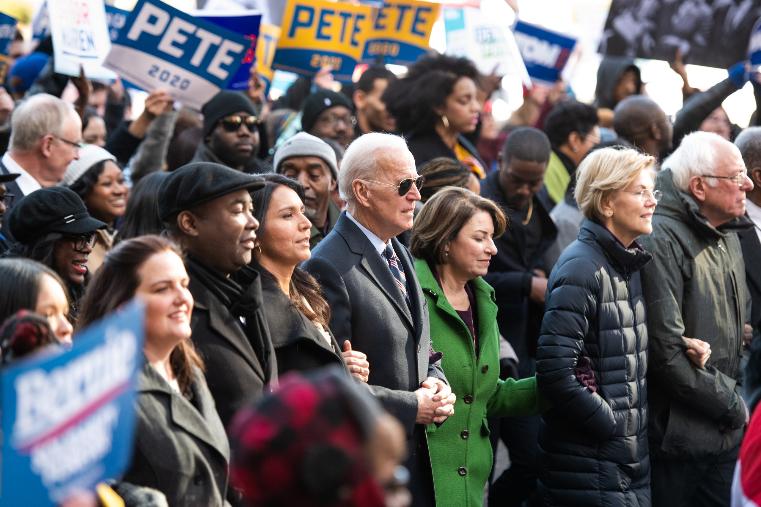 Democratic presidential candidates, Rep. Tulsi Gabbard (D-HI), left, former Vice President Joe Biden, Sen. Amy Klobuchar (D-MN), Sen. Elizabeth Warren (D-MA), and Sen. Bernie Sanders (I-VT), right, march to the King Day event on Jan. 20, 2020, in Columbia, South Carolina. (Credit: Sean Rayford/Getty Images)