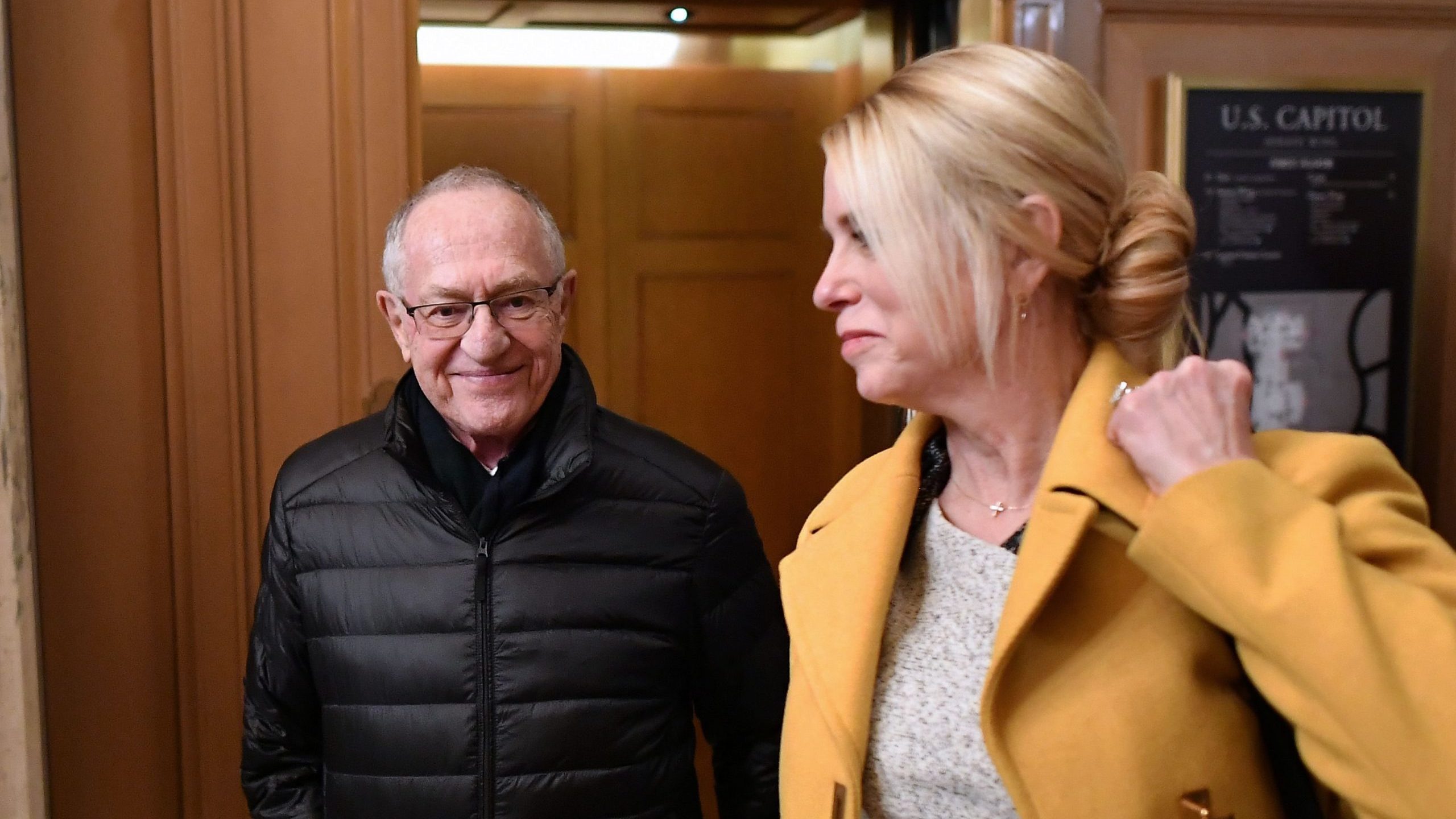 US President Donald Trump lawyers Alan Dershowitz (L) and Pam Bondi depart the Senate chamber after the impeachment trial of US President Donald Trump at the US Capitol in Washington, DC on January 27, 2020. (Credit: MANDEL NGAN/AFP via Getty Images)