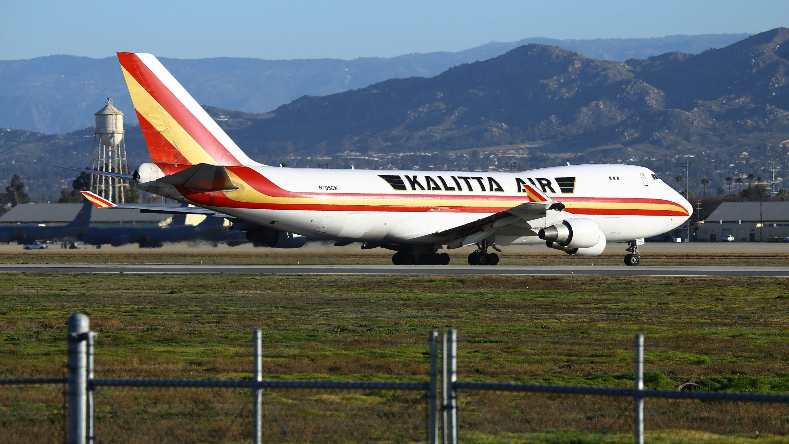 A charter plane lands at March Air Reserve Base in Riverside County on Jan. 29, 2020, with passengers evacuated from Wuhan, the Chinese city at the heart of a growing outbreak of the deadly 2019 novel coronavirus. (Credit: MATT HARTMAN/AFP via Getty Images)