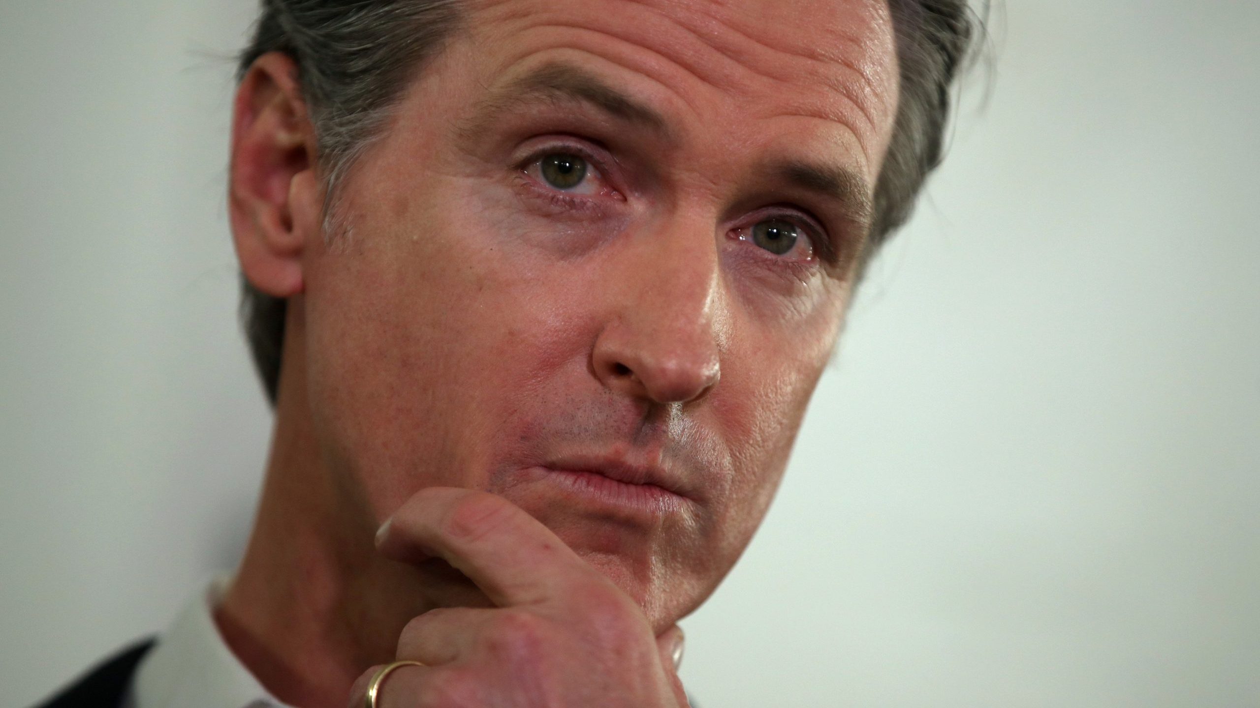 California Gov. Gavin Newsom looks on during a a news conference in Oakland about the state's efforts to address homelessness on Jan. 16, 2020. (Credit: Justin Sullivan / Getty Images)