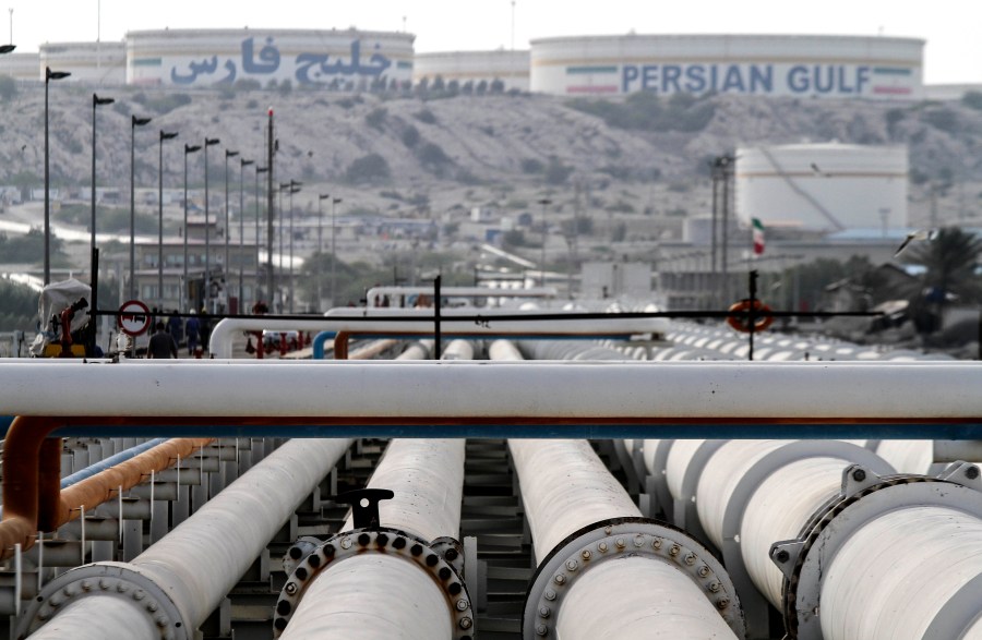 A picture shows export oil pipelines at an oil facility on Kharg Island, a continental island in the Persian Gulf belonging to Iran, on Feb. 23, 2016. (Credit: STR/AFP via Getty Images)