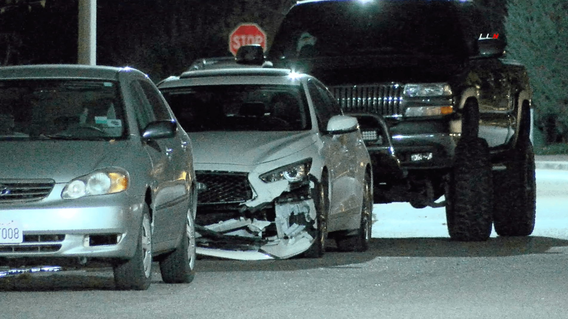 A heavily damaged Infiniti Q45 is parked near a residence where authorities arrested a Corona man believed to be responsible in a crash that left three dead on Jan. 19, 2020. (Credit Loudlabs)