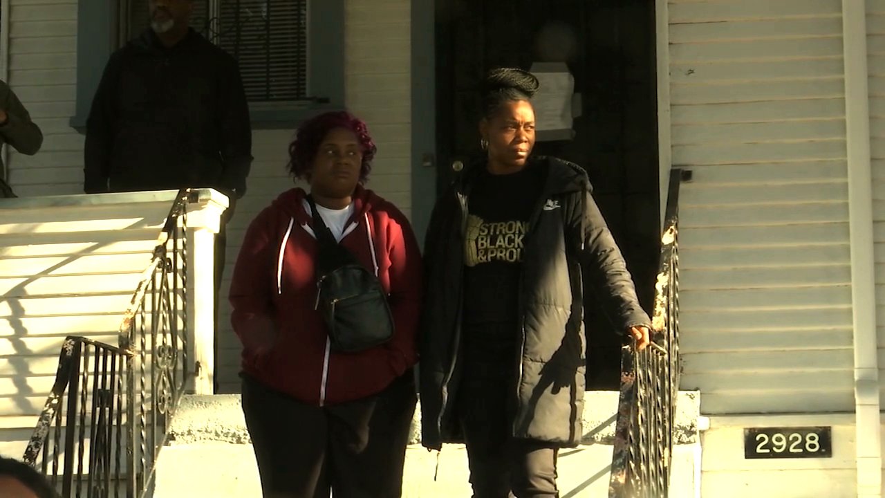 Moms 4 Housing members stand outside an Oakland house the group has been occupying on Jan. 10, 2020. (Credit: KRON)