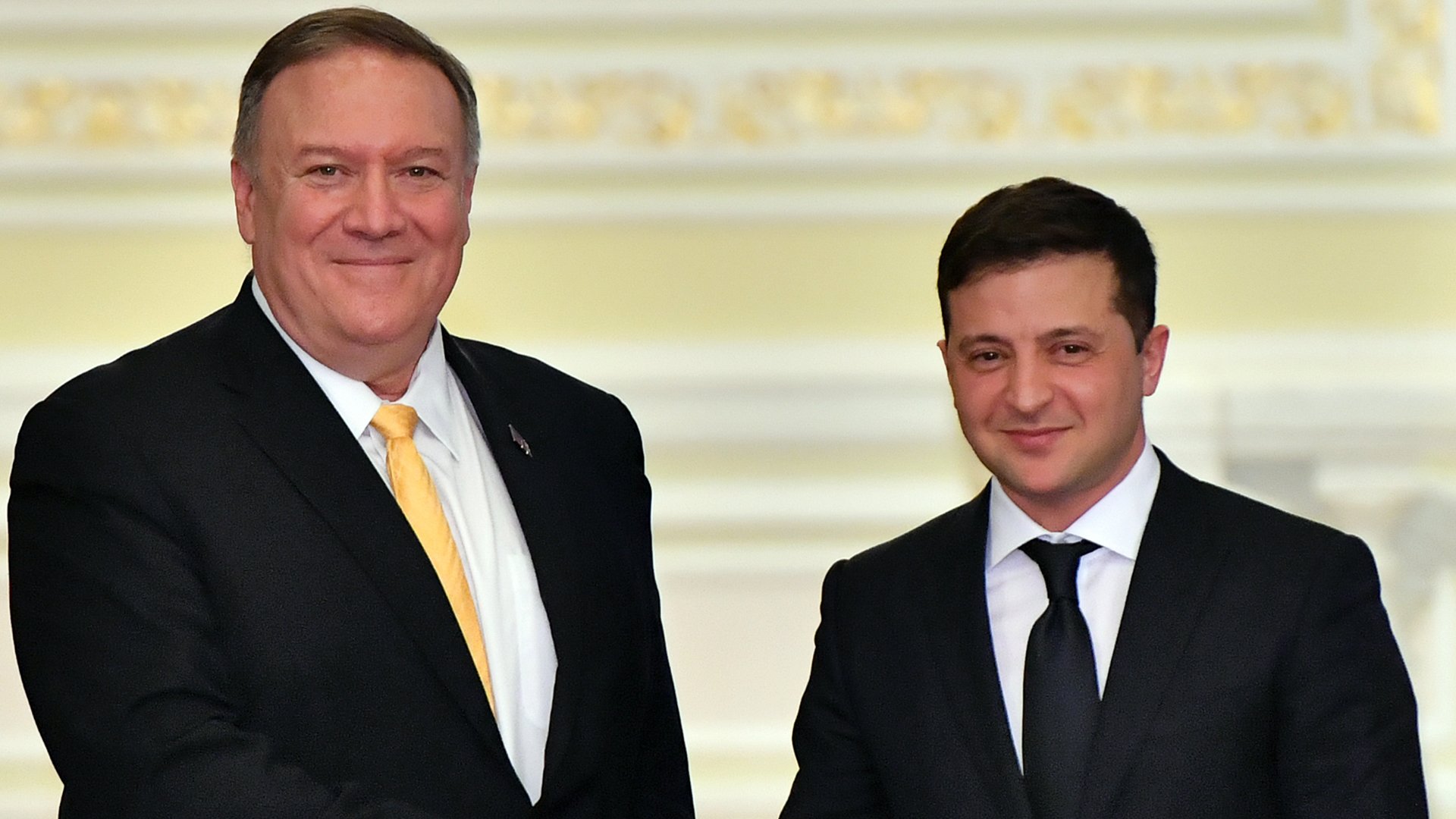 U.S. Secretary of State Mike Pompeo and Ukraine's President Volodymyr Zelensky shake hands as they address the media following their meeting in Kiev on Jan. 31, 2020. (Credit: Sergei SUPINSKY/ AFP via Getty Images)