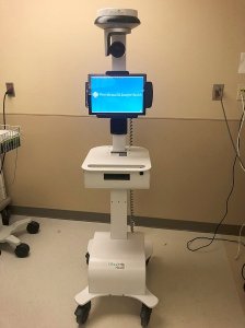 Doctors are using a robot to communicate with the man from outside the isolation area. (Credit: CNN)