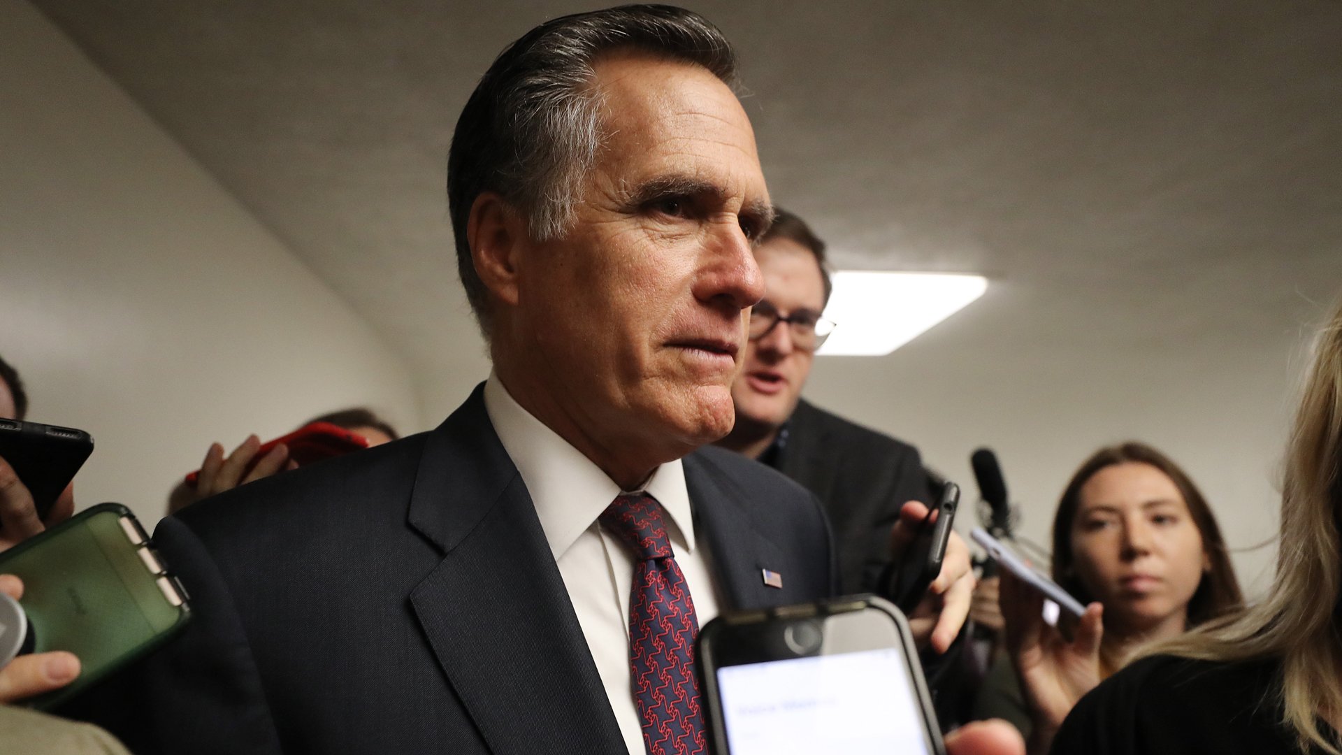 Sen. Mitt Romney speaks to reporters upon arriving to the U.S. Capitol for the Senate impeachment trial on Jan. 28, 2020. (Credit: Mario Tama / Getty Images)