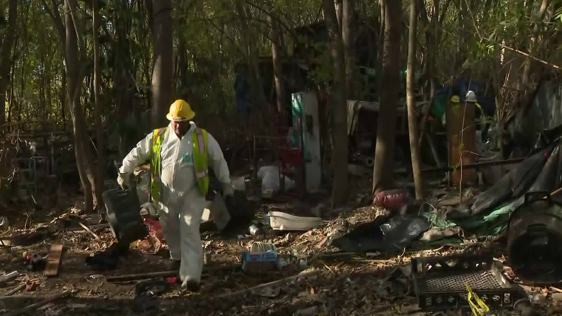 Cleanup crews clear homeless encampments at the Sepulveda Basin on Jan. 8, 2020. (Credit: KTLA)