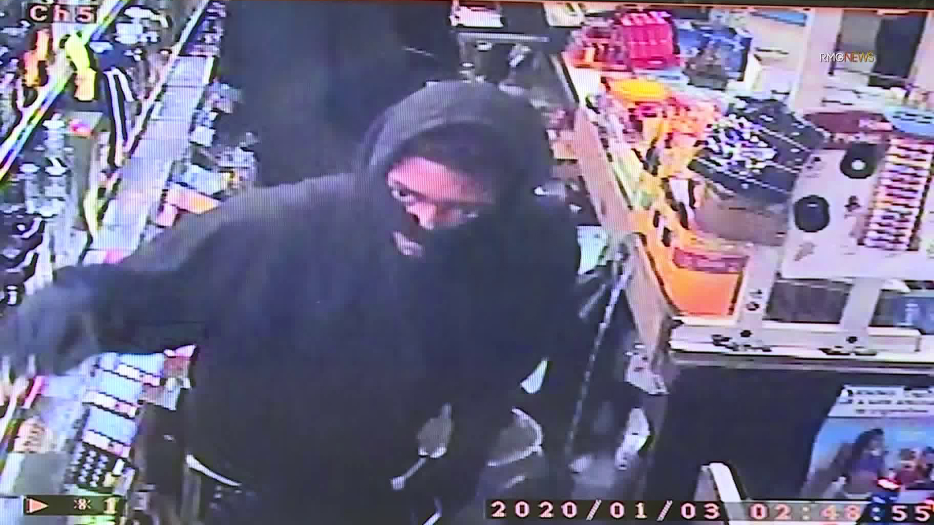 An armed robbery suspect is seen in a surveillance image provided by Lucky 7 Liquor in Culver City.