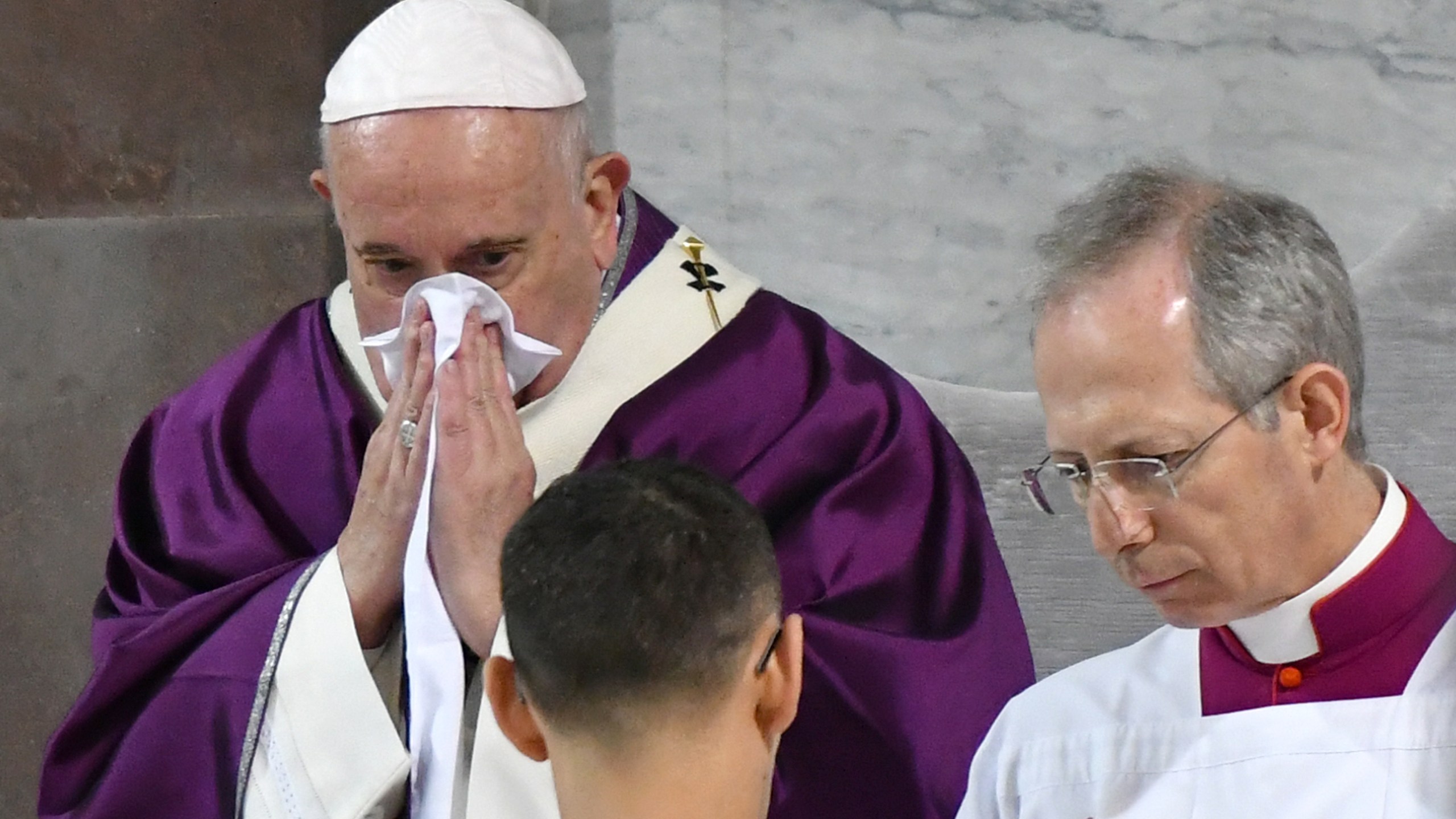 Pope Francis blows his nose as he leads the Ash Wednesday mass on February 26, 2020, at the Santa Sabina church in Rome. (ALBERTO PIZZOLI/AFP via Getty Images)