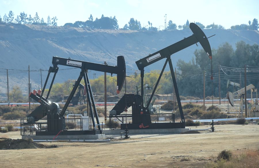 Oil derricks at the Chevron Oil Field in Bakersfield are seen on Nov. 21, 2016. (Frederic J. Brown / AFP / Getty Images)