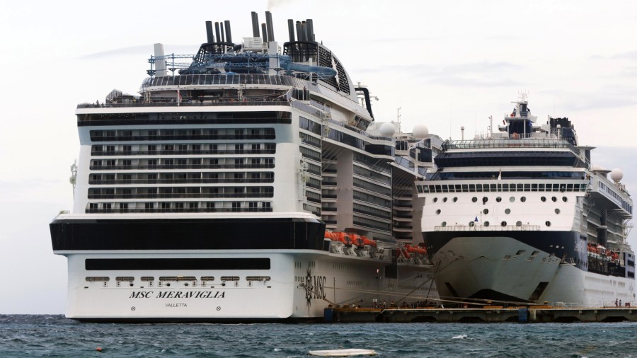 MSC Merviglia cruise ship, left, is seen in Cozumel, Mexico, on Feb. 27, 2020. (Credit: JOSE CASTILLO/AFP via Getty Images)