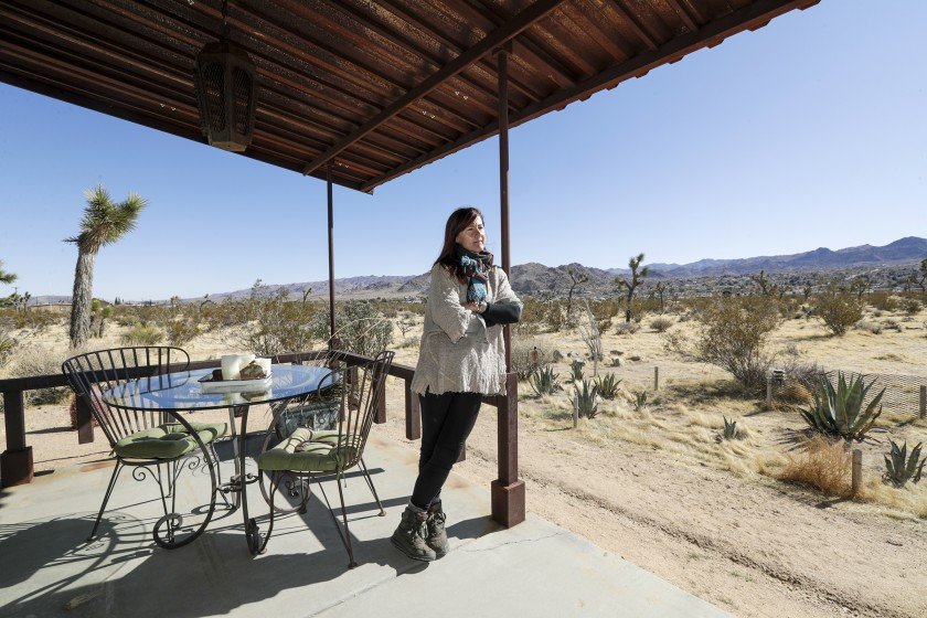 Amanda B’Hymer, who owns a vacation home in Joshua Tree, says she’s wary of San Bernardino County’s stepped-up code enforcement of hundreds of its short-term rental homes, which under a new ordinance must be inspected in order to get a permit to continue operating. The number of these rentals has exploded 21% over the last year alone.(Credit: Irfan Khan / Los Angeles Times)