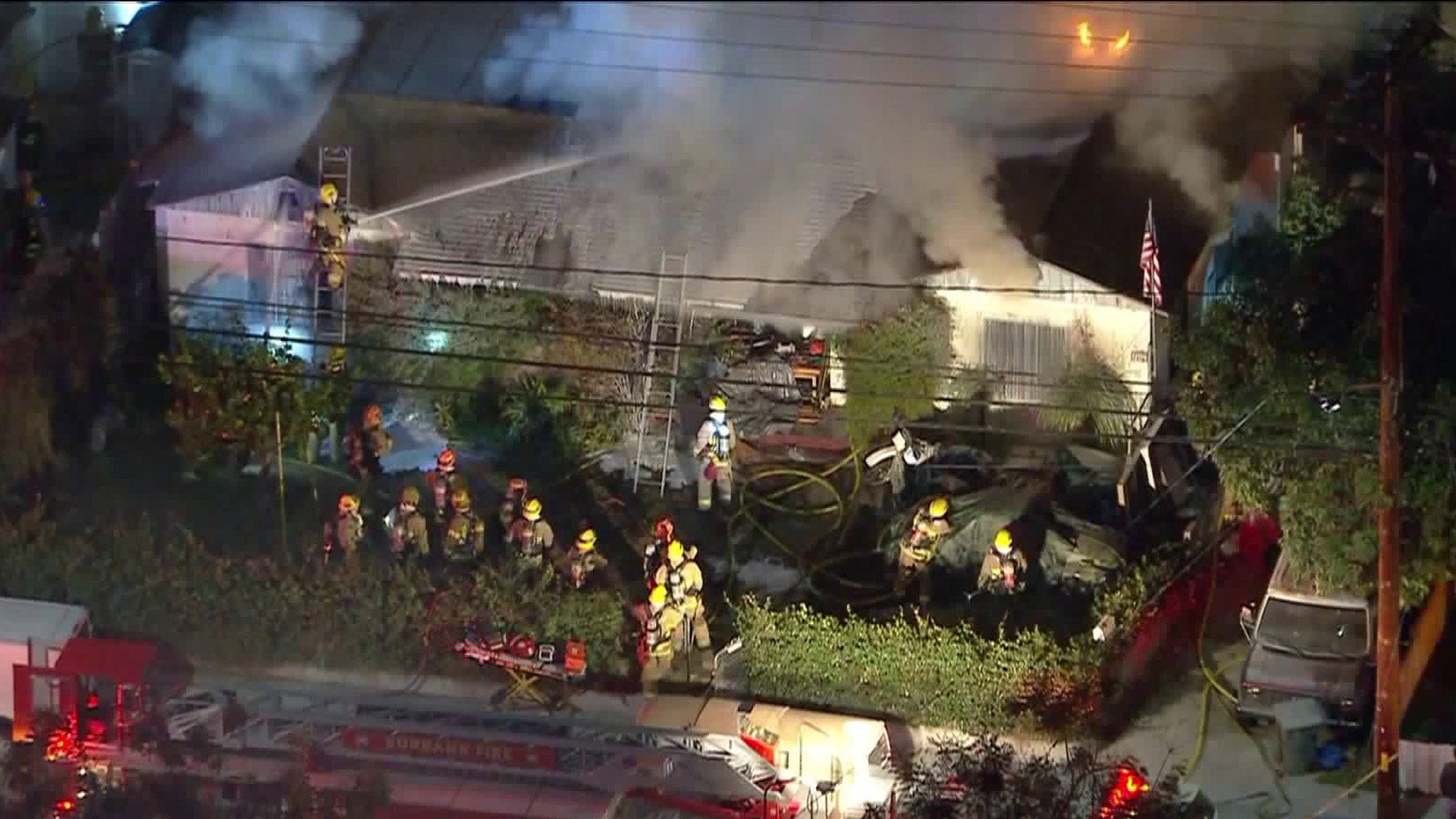 Sky5 footage shows firefighters putting out a fire at a home located at 1204 South Lake St. in Burbank on Feb. 13, 2020. (Credit: KTLA)