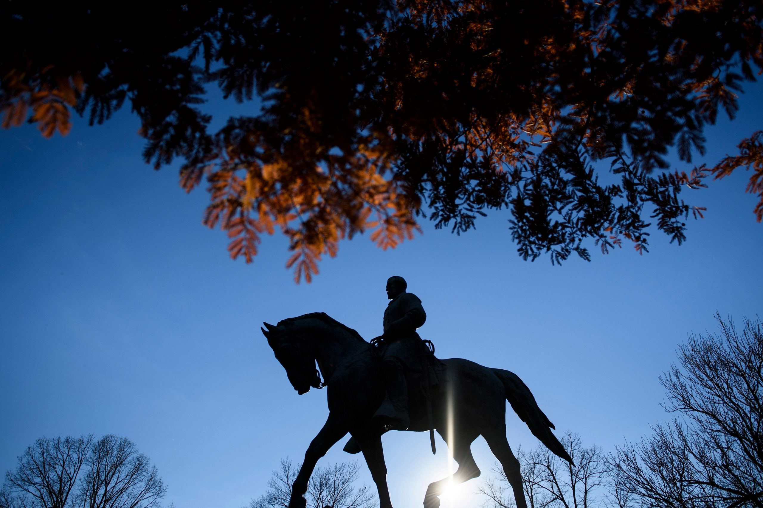 A statue of Confederate General Robert Edward Lee is seen in Market Street Park on November 26, 2018 in Charlottesville, Virginia. (Credit: BRENDAN SMIALOWSKI/AFP via Getty Images)