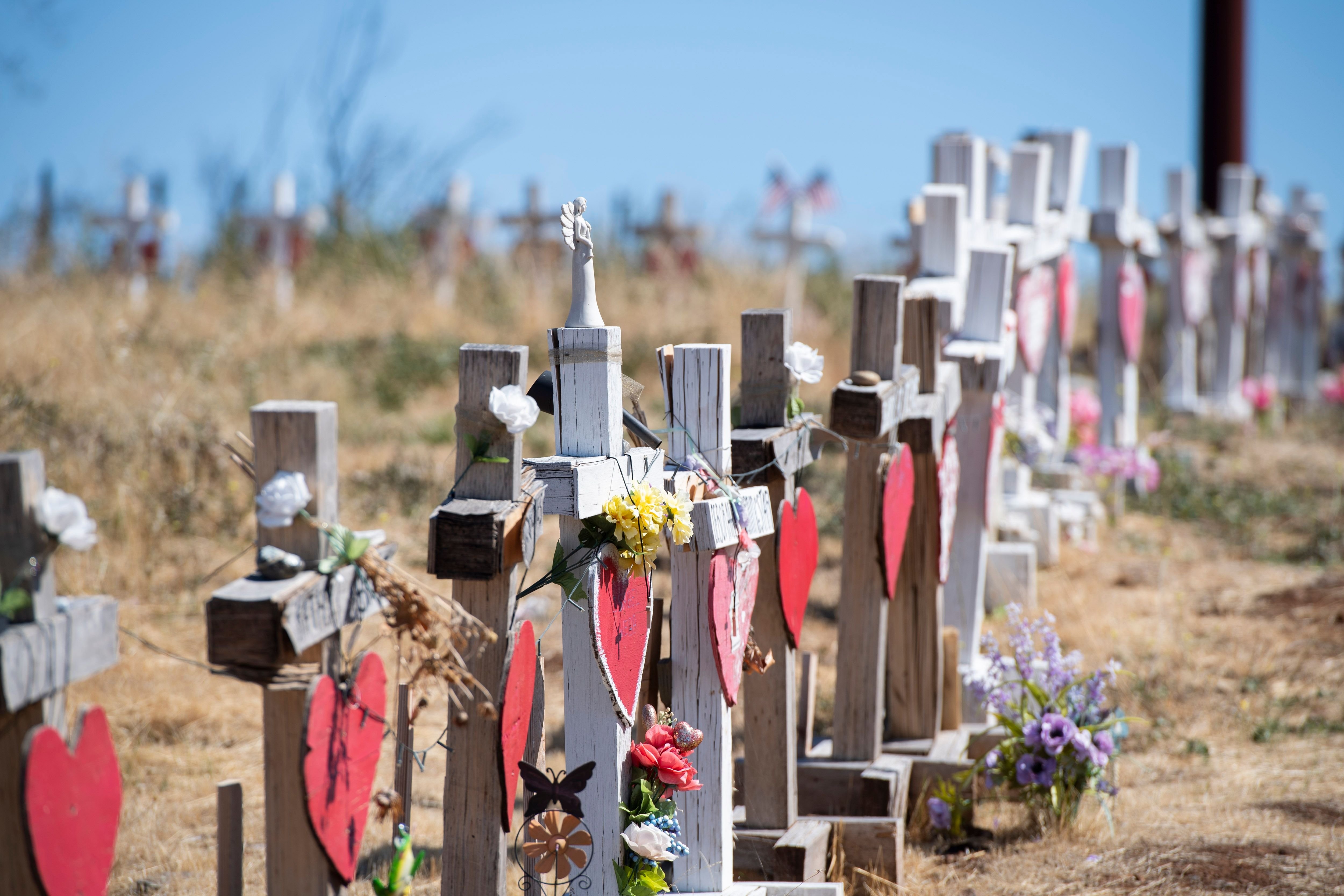 Crosses line a road in Paradise on Oct. 2, 2019, in honor of those who died as a result of the Camp Fire. (Credit: Robyn Beck / AFP / Getty Images)