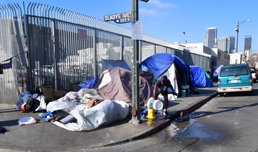 Tents of the homeless line a street corner in Los Angeles on Jan. 8, 2020. (Credit: Frederic J. Brown / AFP / Getty Images)