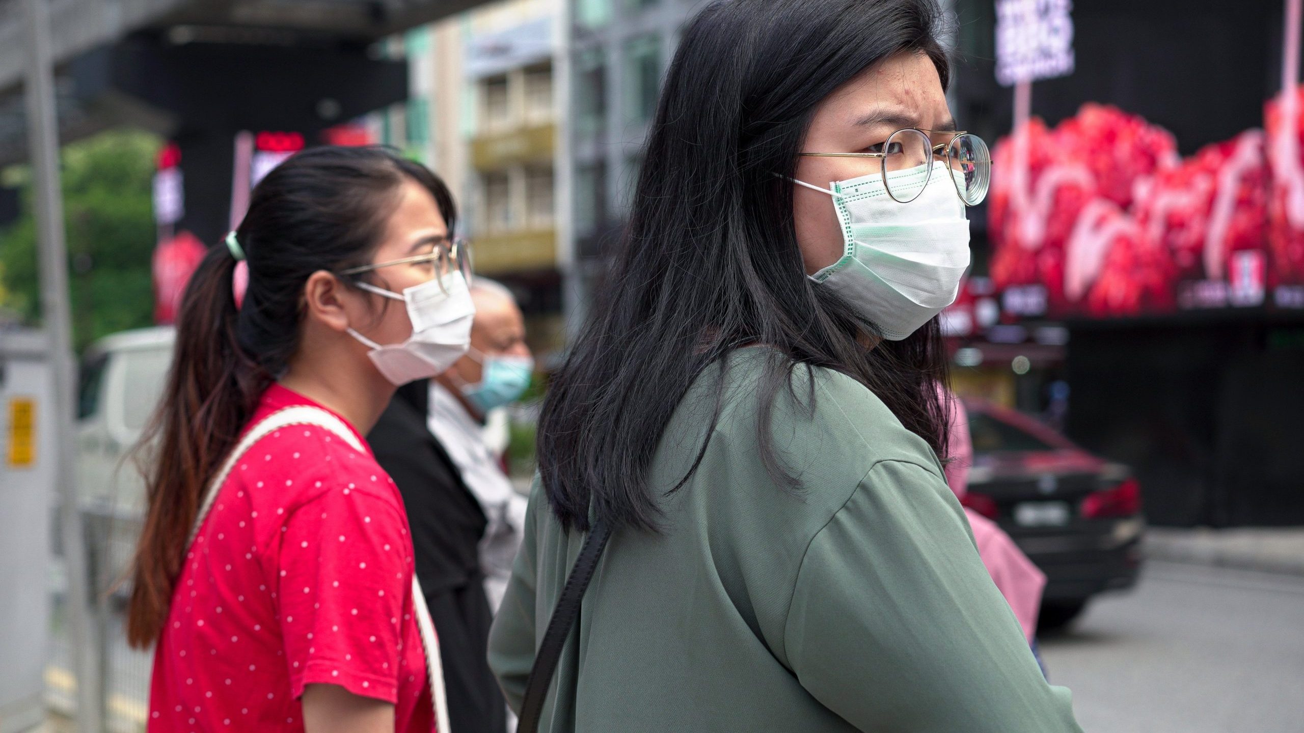 Visitors wearing masks wait at a traffic junction in Bukit Bintang district on Feb. 5, 2020, in Kuala Lumpur, Malaysia. The coronavirus, originating in Wuhan, China, has spread around the globe. (Credit: Ore Huiying/Getty Images)