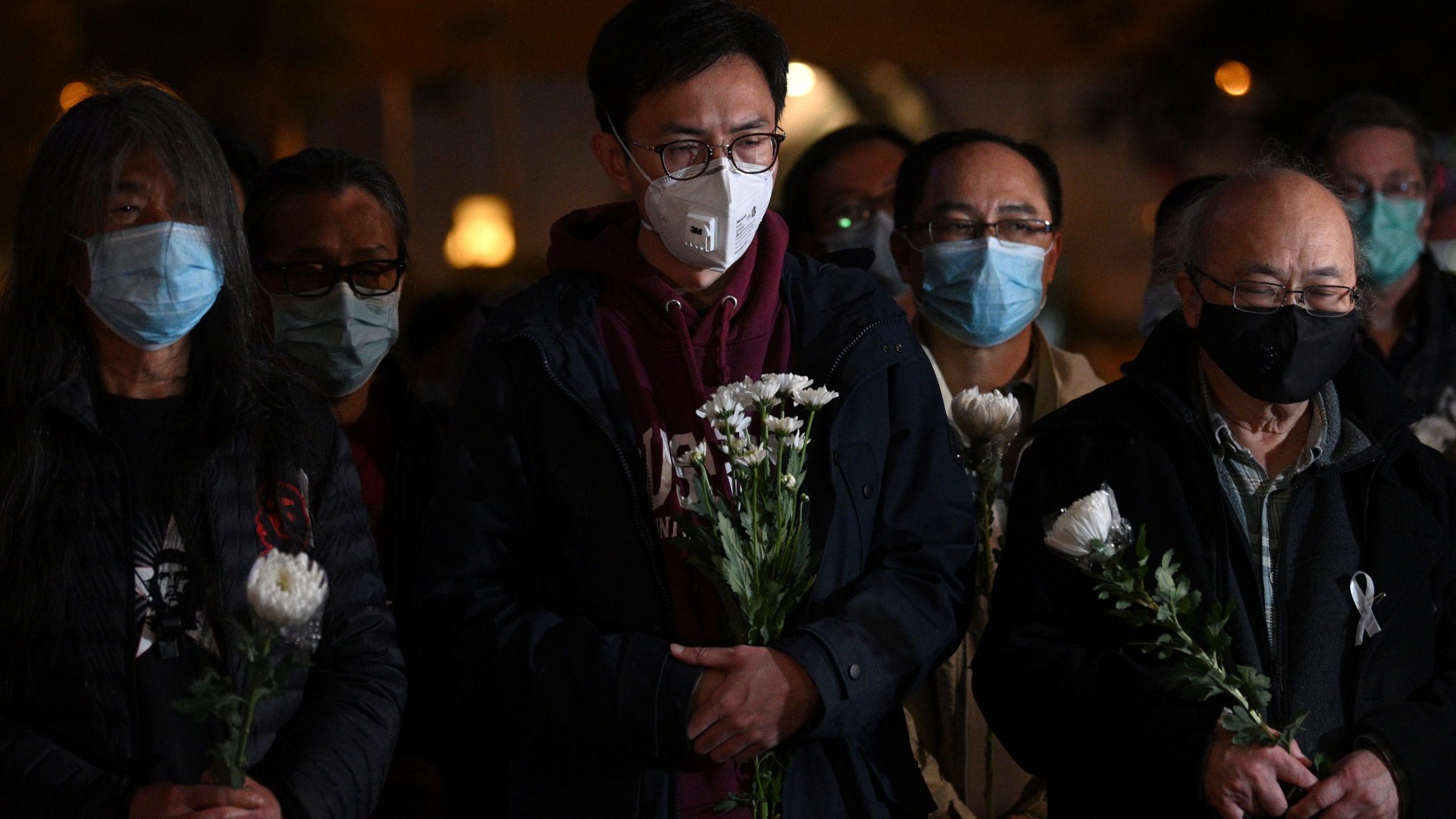 People attend a vigil in Hong Kong Feb. 7, 2020, for novel coronavirus whistleblowing doctor Li Wenliang, 34, who died in Wuhan after contracting the virus while treating a patient. (Credit: ANTHONY WALLACE/AFP via Getty Images)