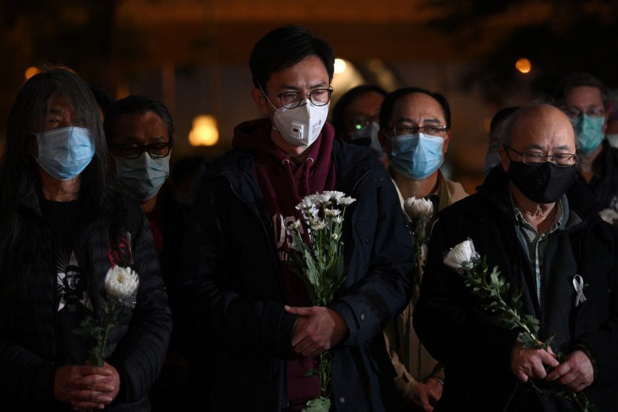 People attend a vigil in Hong Kong Feb. 7, 2020, for novel coronavirus whistleblowing doctor Li Wenliang, 34, who died in Wuhan after contracting the virus while treating a patient. (Credit: ANTHONY WALLACE/AFP via Getty Images)