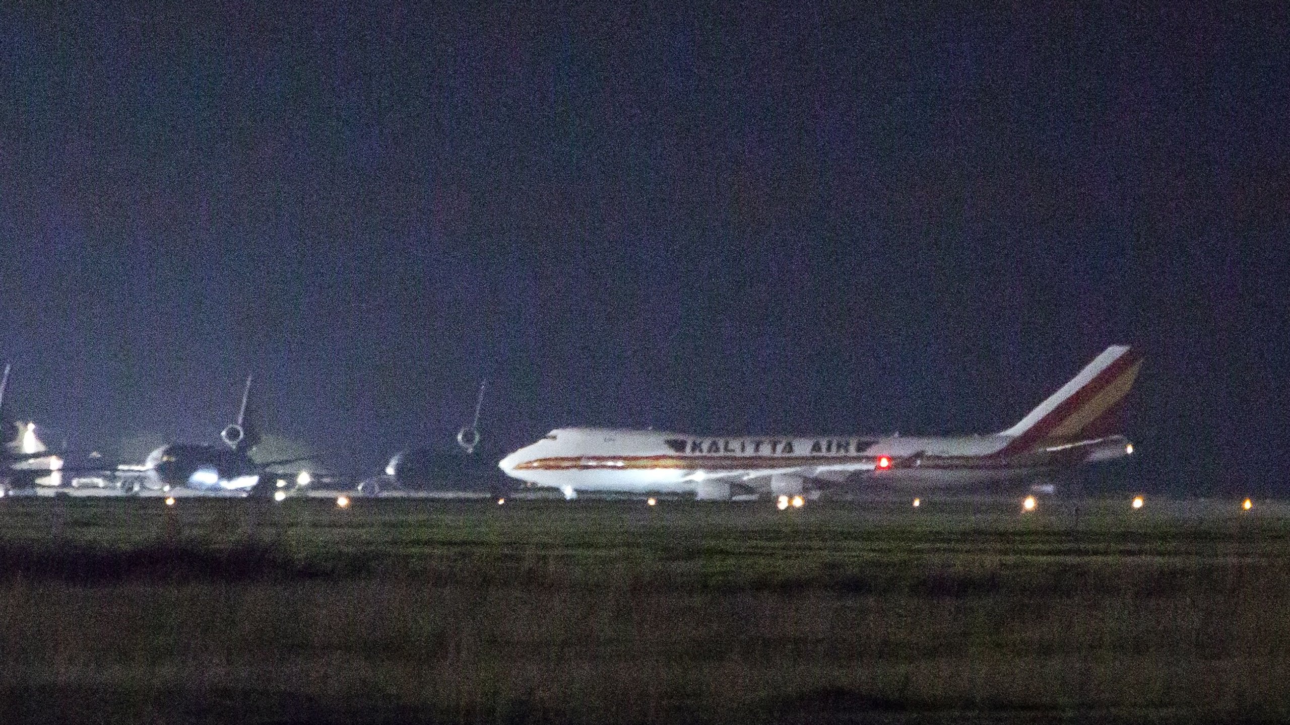 A plane carrying American passengers, who were recently released from the Diamond Princess cruise ship in Japan, arrives at Travis Air Force Base in Northern California on Feb. 16, 2020. (Credit: BRITTANY HOSEA-SMALL/AFP via Getty Images)