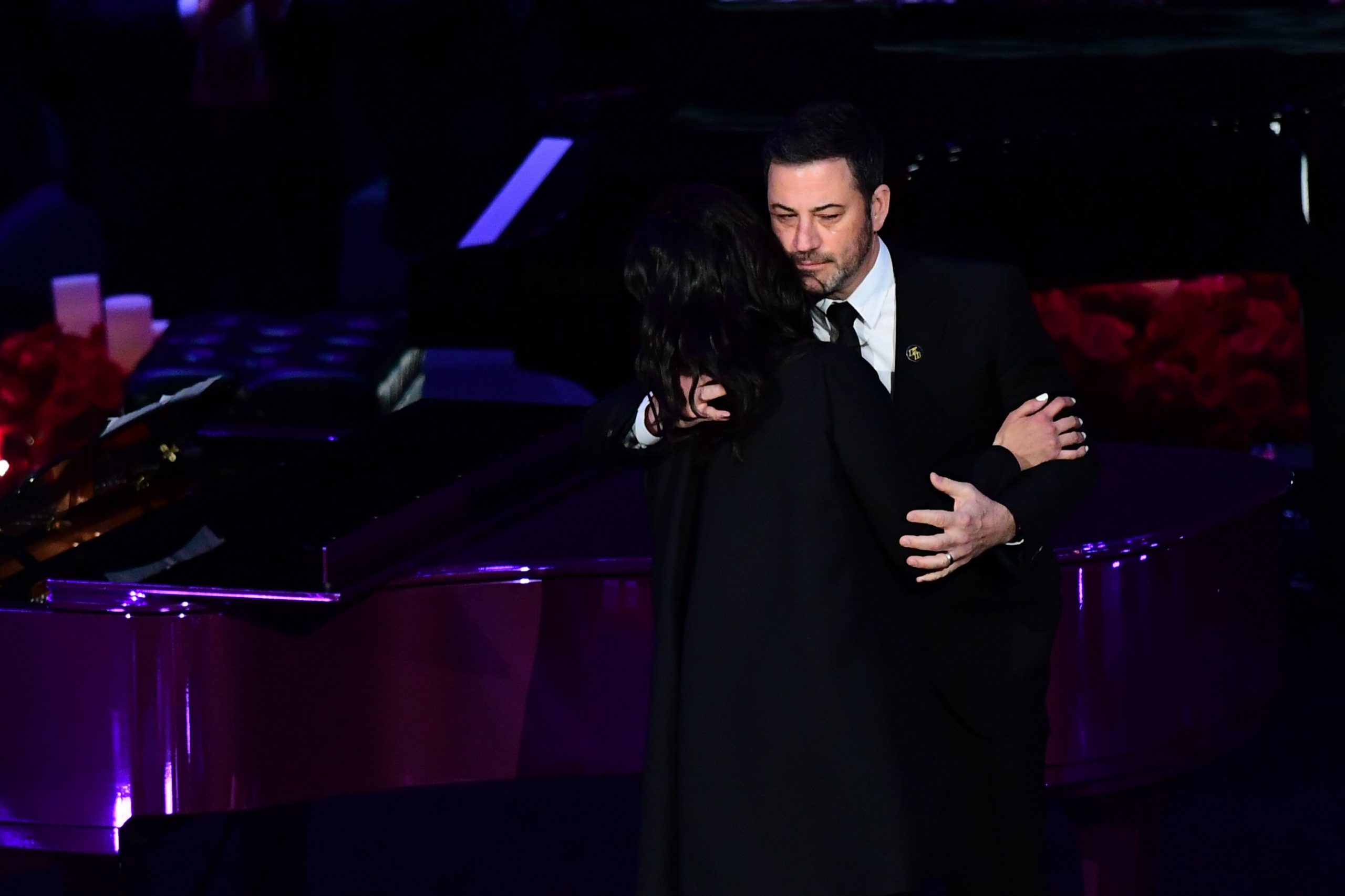 Kobe Bryant's wife Vanessa Bryant (L) hugs television host Jimmy Kimmel as she arrives to speak during the "Celebration of Life for Kobe and Gianna Bryant" service at Staples Center in Downtown Los Angeles on Feb. 24, 2020. (Credit: Frederic J. Brown/ AFP)