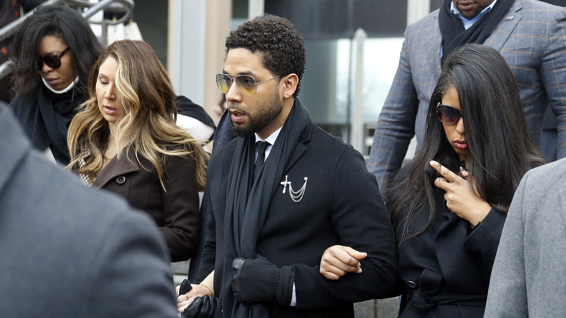 Flanked by attorneys and supporters, actor Jussie Smollett walks out of the Leighton Criminal Courthouse after pleading not guilty to a new indictment on Feb. 24, 2020 in Chicago. (Credit: Nuccio DiNuzzo/Getty Images)