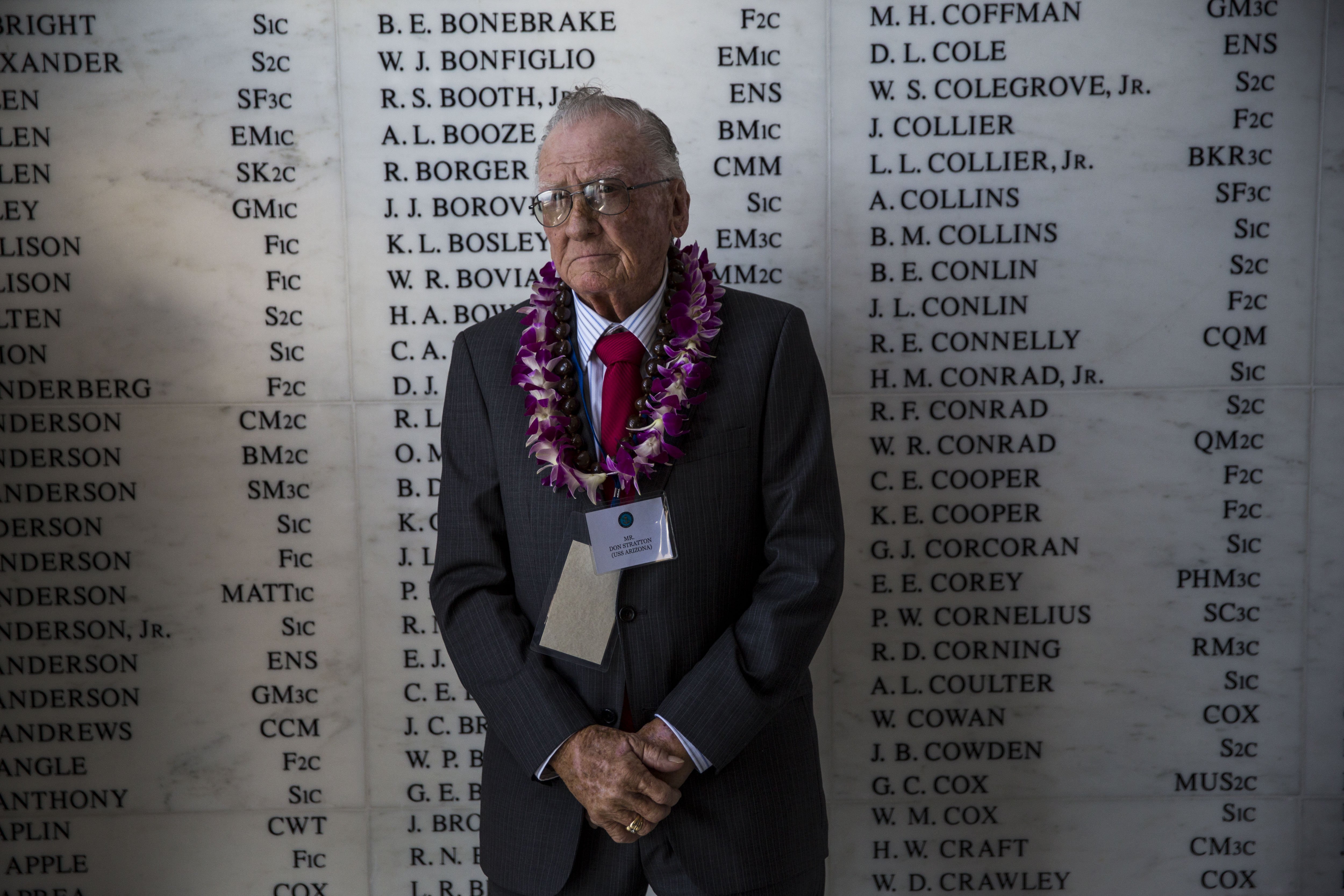 U.S.S. Arizona survivor Donald Stratton stands in front of the remembrance wall in the shrine room the U.S.S. Arizona Memorial during a memorial service for the 73rd anniversary of the attack on the U.S. naval base at Pearl harbor on the island of Oahu at the Pacific National Monument on December 07, 2014 in Pearl Harbor, Hawaii. (Credit: Kent Nishimura/Getty Images)