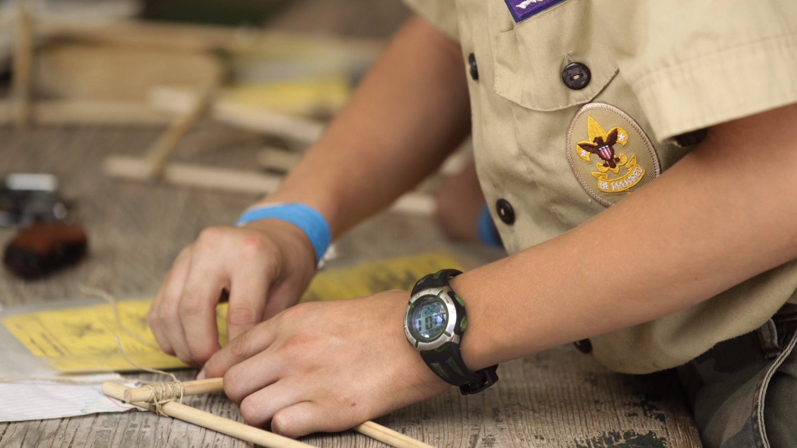 Boy Scouts work on a wood project at camp Maple Dell outside Payson, Utah, on July 31, 2015. (Credit: George Frey / Getty Images)