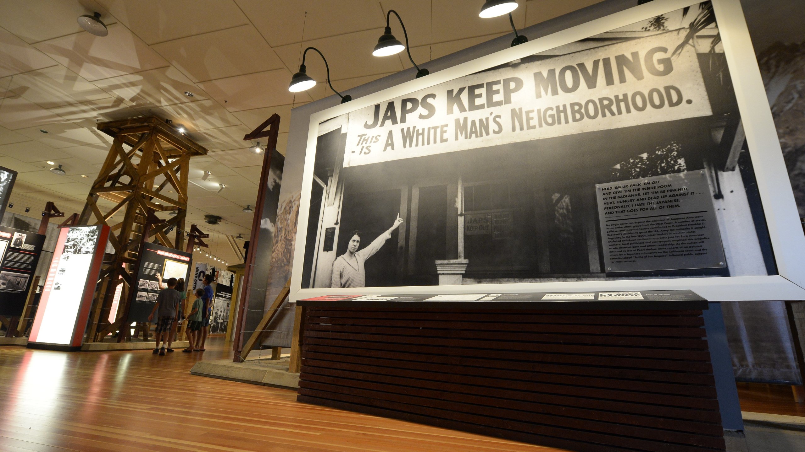 Old photographs are displayed in the exhibition hall at WW II-era Manzanar internment camp, in Manzanar, about 230 miles northeast of Los Angeles, on Aug. 2, 2015. (Credit: ROBYN BECK/AFP via Getty Images)