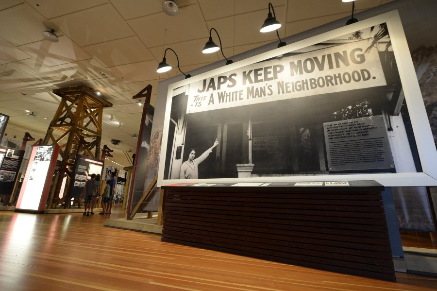 Old photographs are displayed in the exhibition hall at WW II-era Manzanar internment camp, in Manzanar, about 230 miles northeast of Los Angeles, on Aug. 2, 2015. (Credit: ROBYN BECK/AFP via Getty Images)