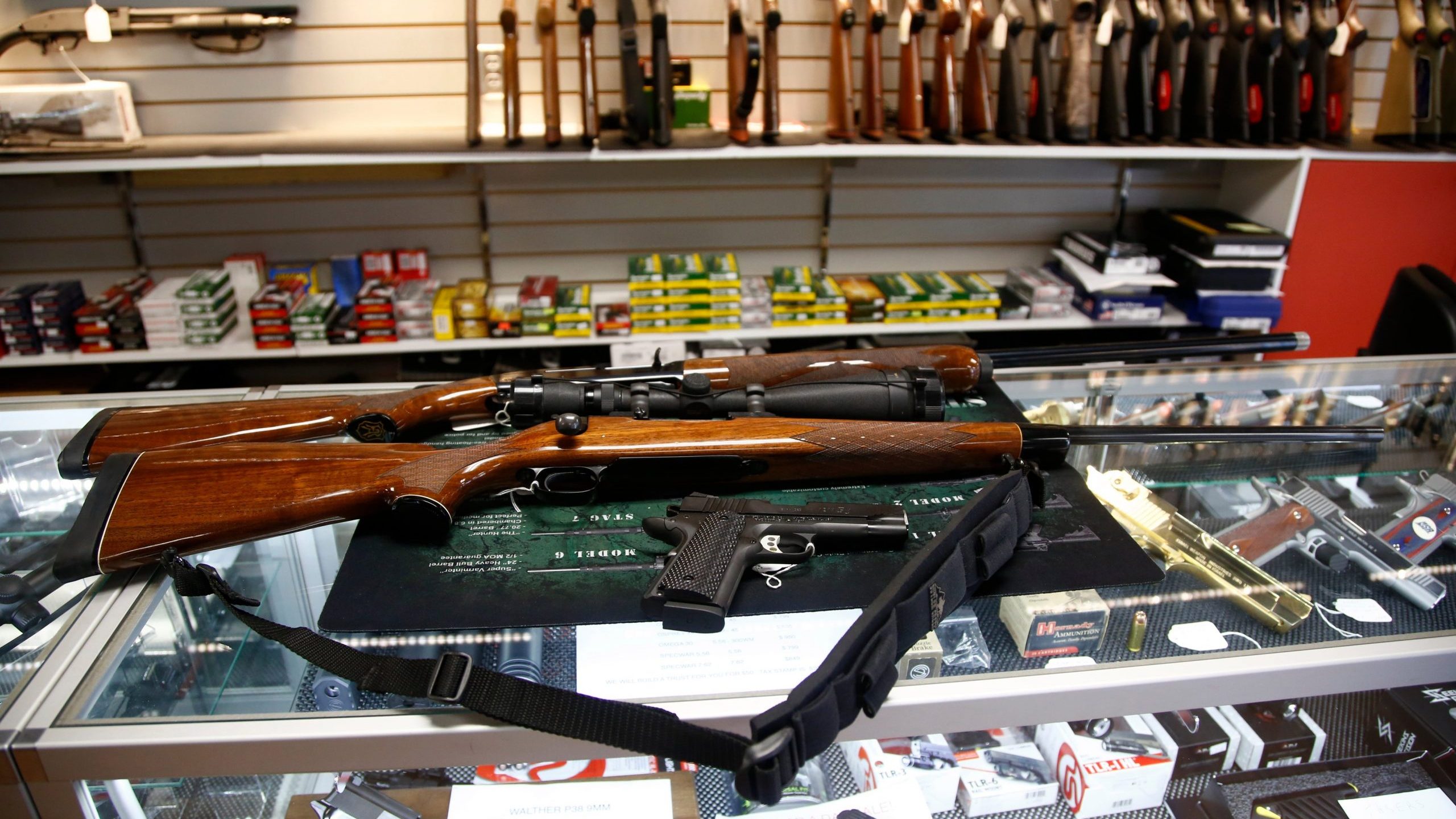 A Remington 700 hunting rifle, a Remington 1100 shotgun and a Remington R1 Enhanced model 1911 pistol are seen for sale at Atlantic Outdoors gun shop on March 26, 2018, in Stokesdale, North Carolina. (Credit: Brian Blanco/Getty Images)