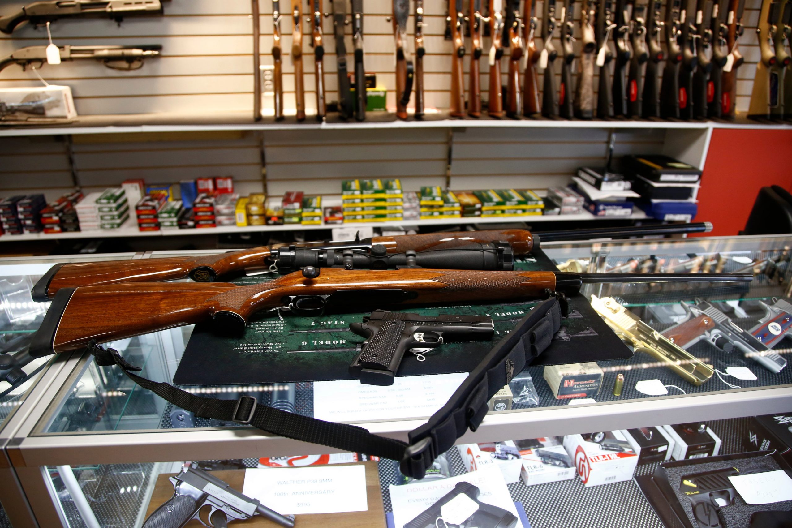 A Remington 700 hunting rifle, a Remington 1100 shotgun and a Remington R1 Enhanced model 1911 pistol are seen for sale at Atlantic Outdoors gun shop on March 26, 2018, in Stokesdale, North Carolina. (Credit: Brian Blanco/Getty Images)