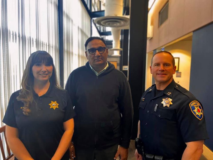 Rajbir Singh stands with Roseville Police records clerk Megan Harrigan and police Capt. Josh Simon in this undated photo. (Credit: Roseville Police Department via CNN)